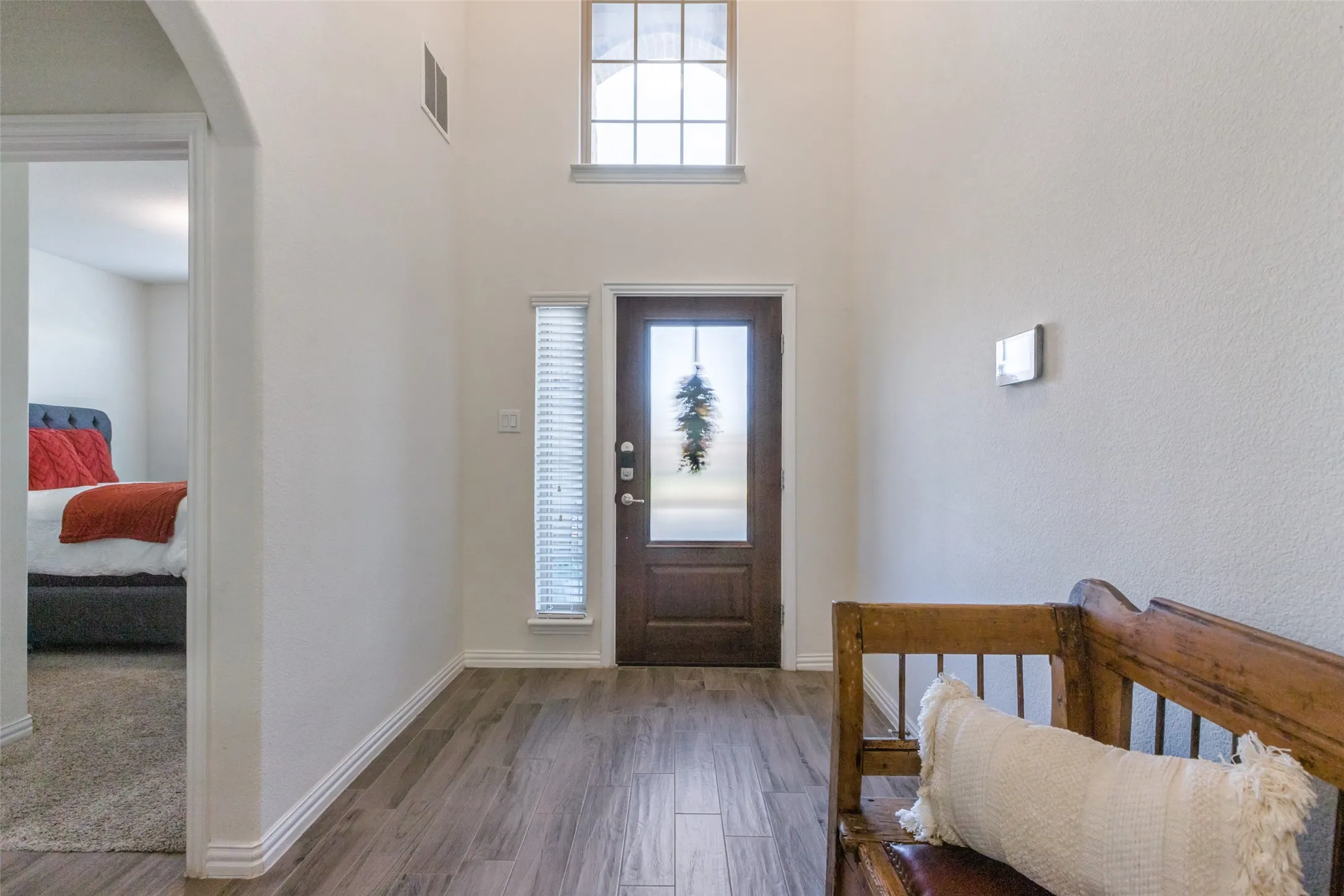 Foyer entrance featuring hardwood / wood-style floors and plenty of natural light