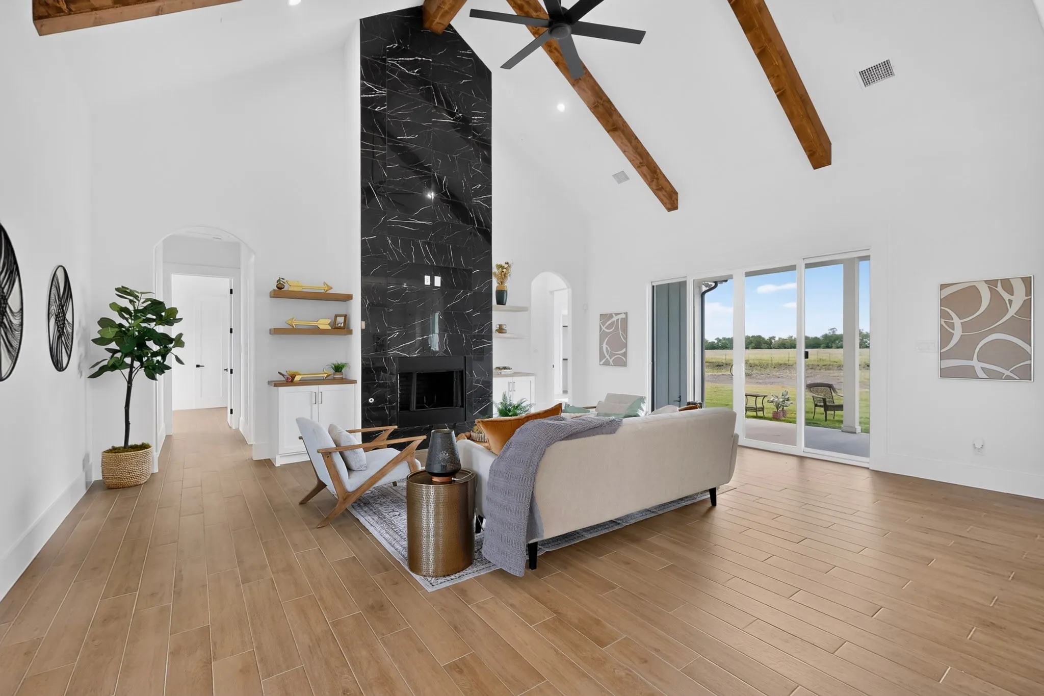 Vaulted ceiling featuring exposed wood beams