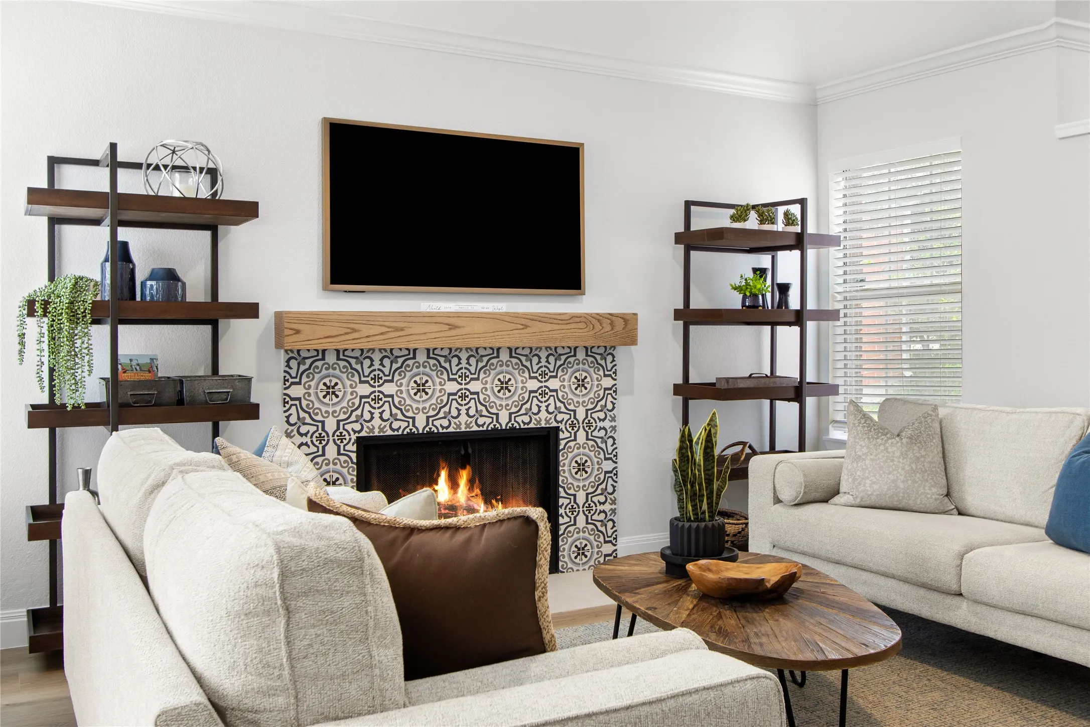 Living area featuring a fireplace with decorative tile surround and a wood mantel