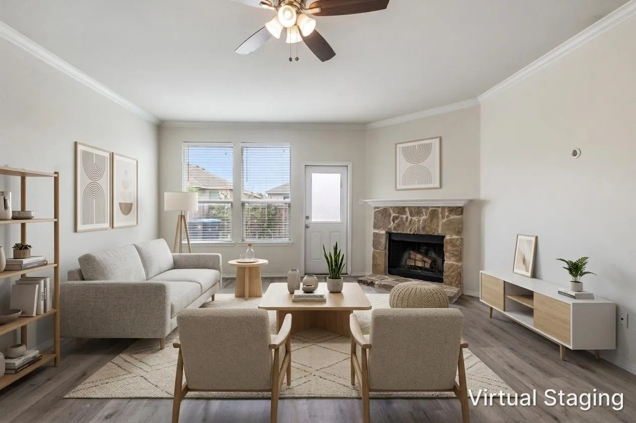 Spacious living area featuring a stone-clad fireplace, wood-finish flooring, a ceiling fan, and crown molding