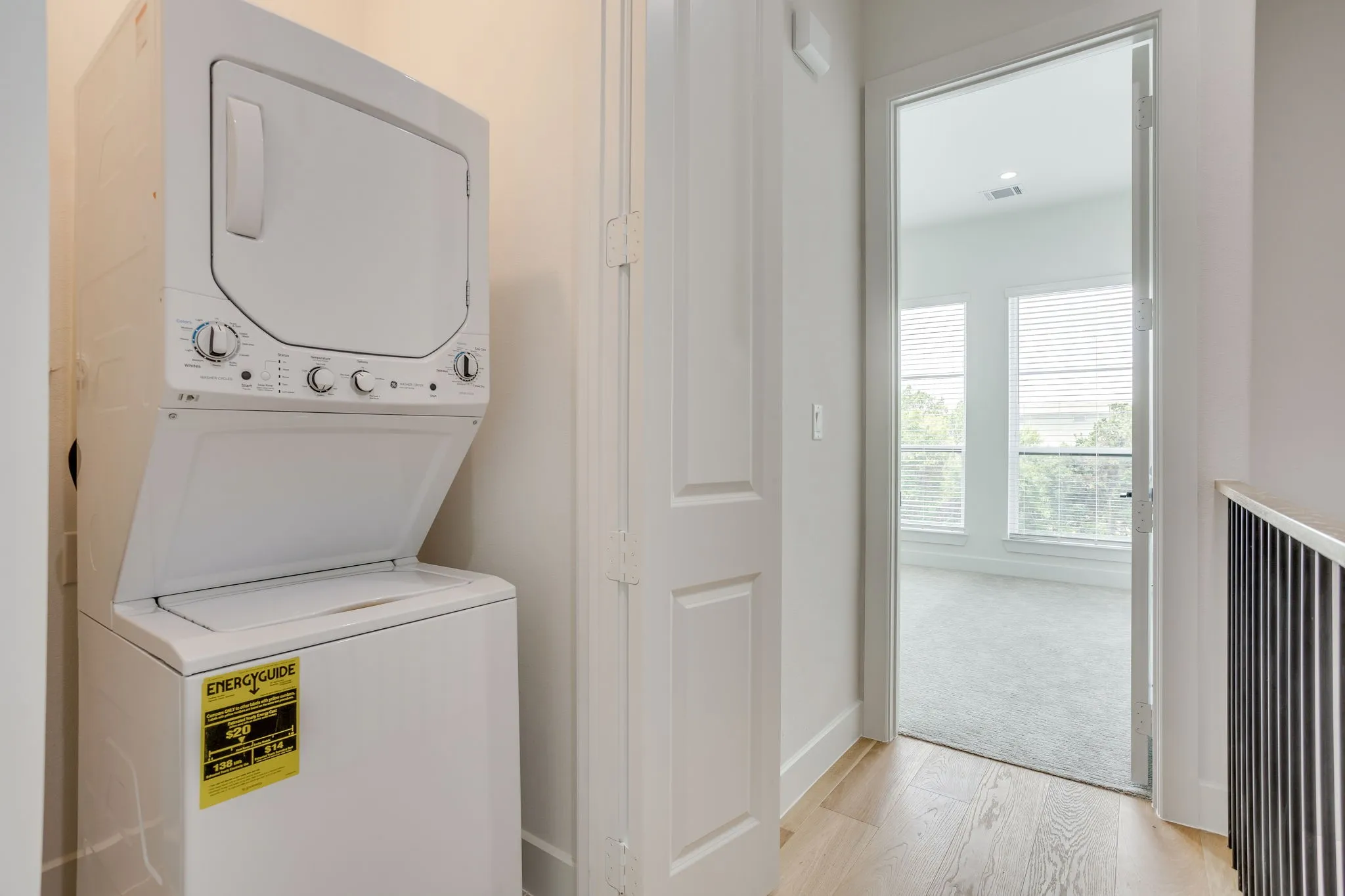 Stackable laundry appliances integrated into the hallway