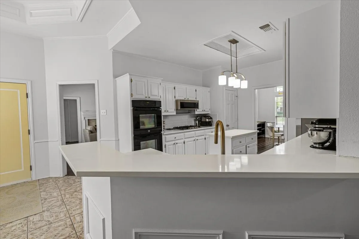 Kitchen with bar counter-space area