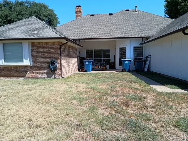 Spacious backyard with covered patio