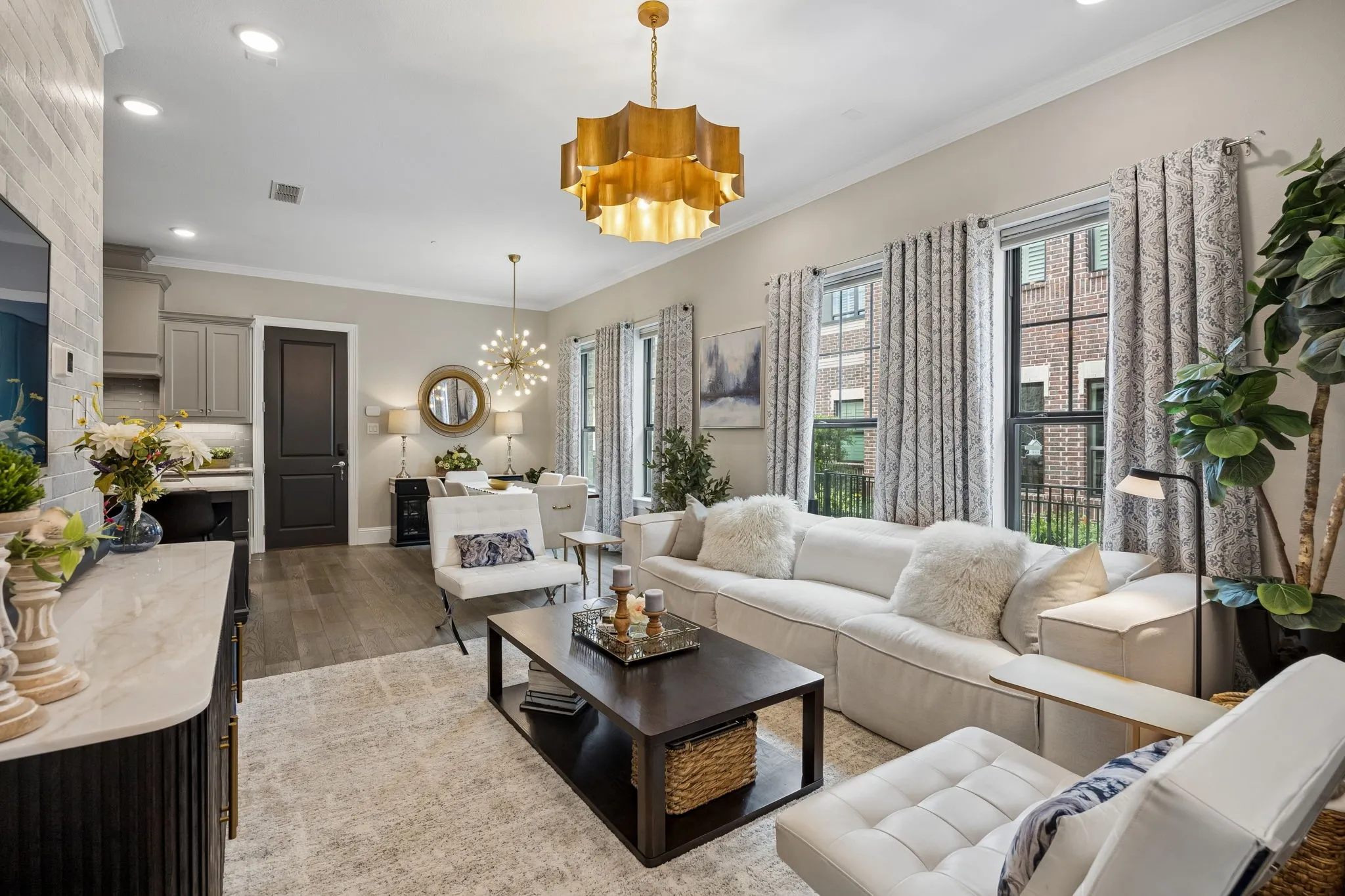 Beautiful family room with accent wall and upgraded designer lighting