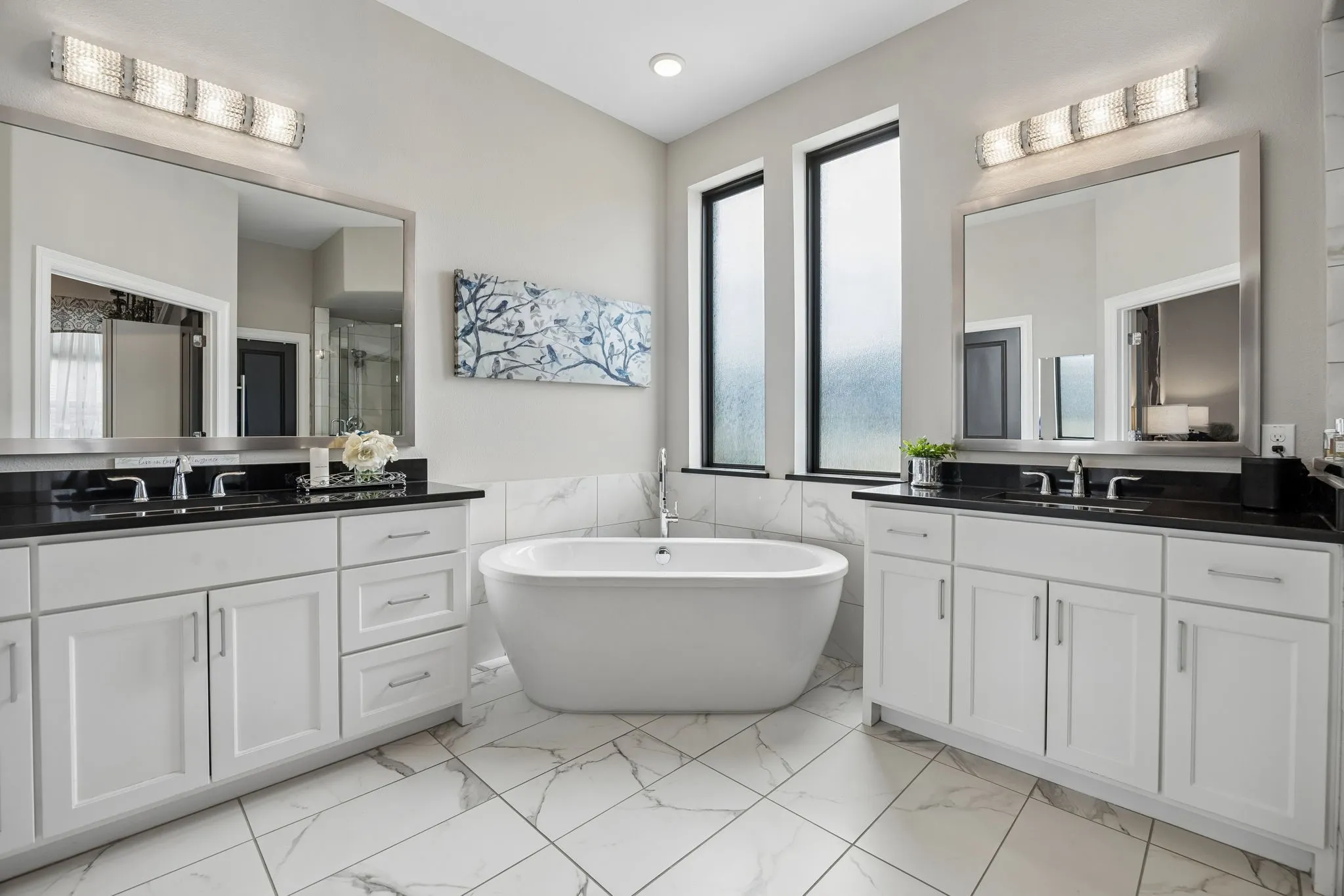 Primary bathroom with split vanities