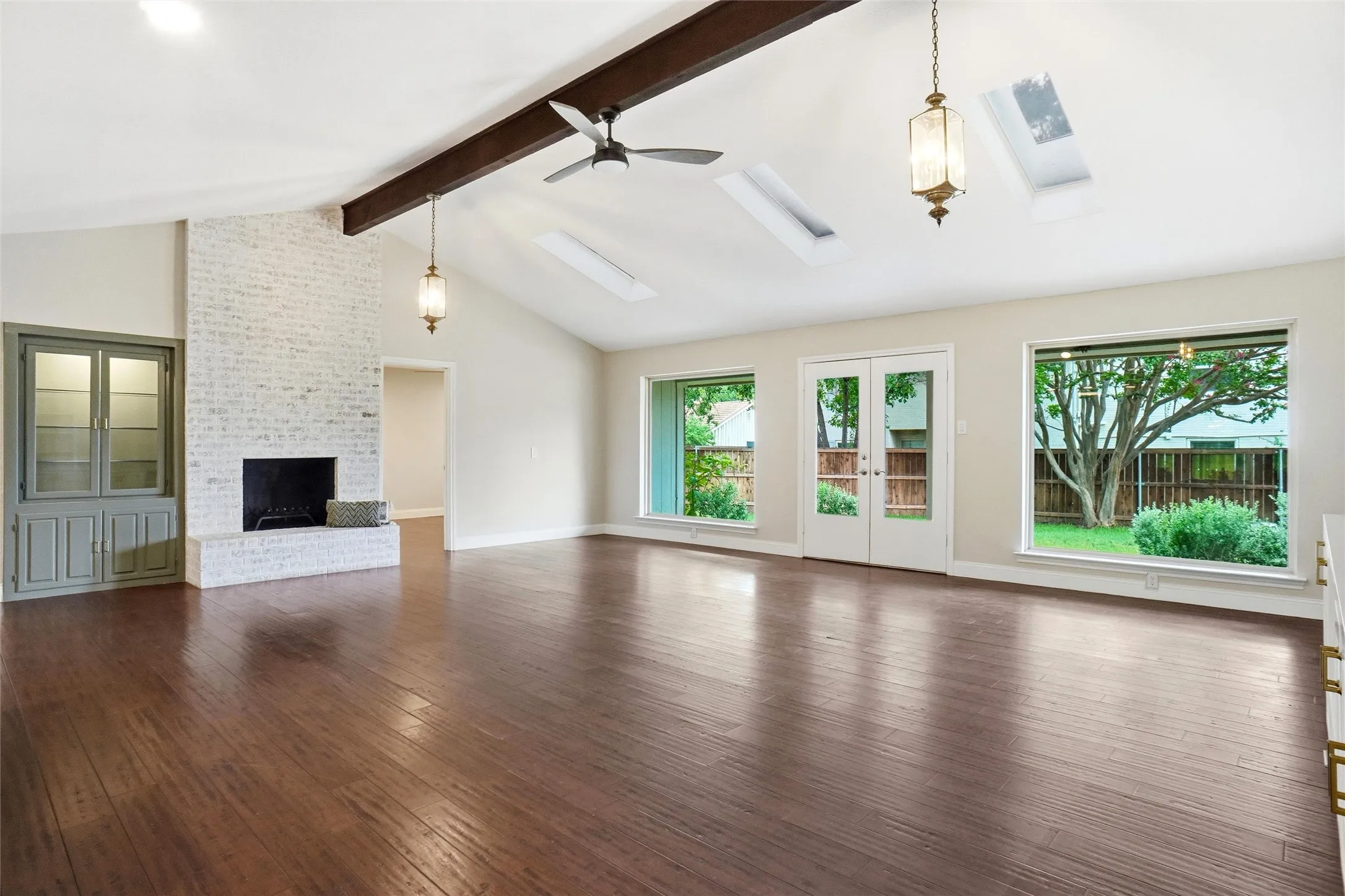 Look at the natural light! Don't miss the built in cabinetry at both ends of the room, for displaying your treasures!