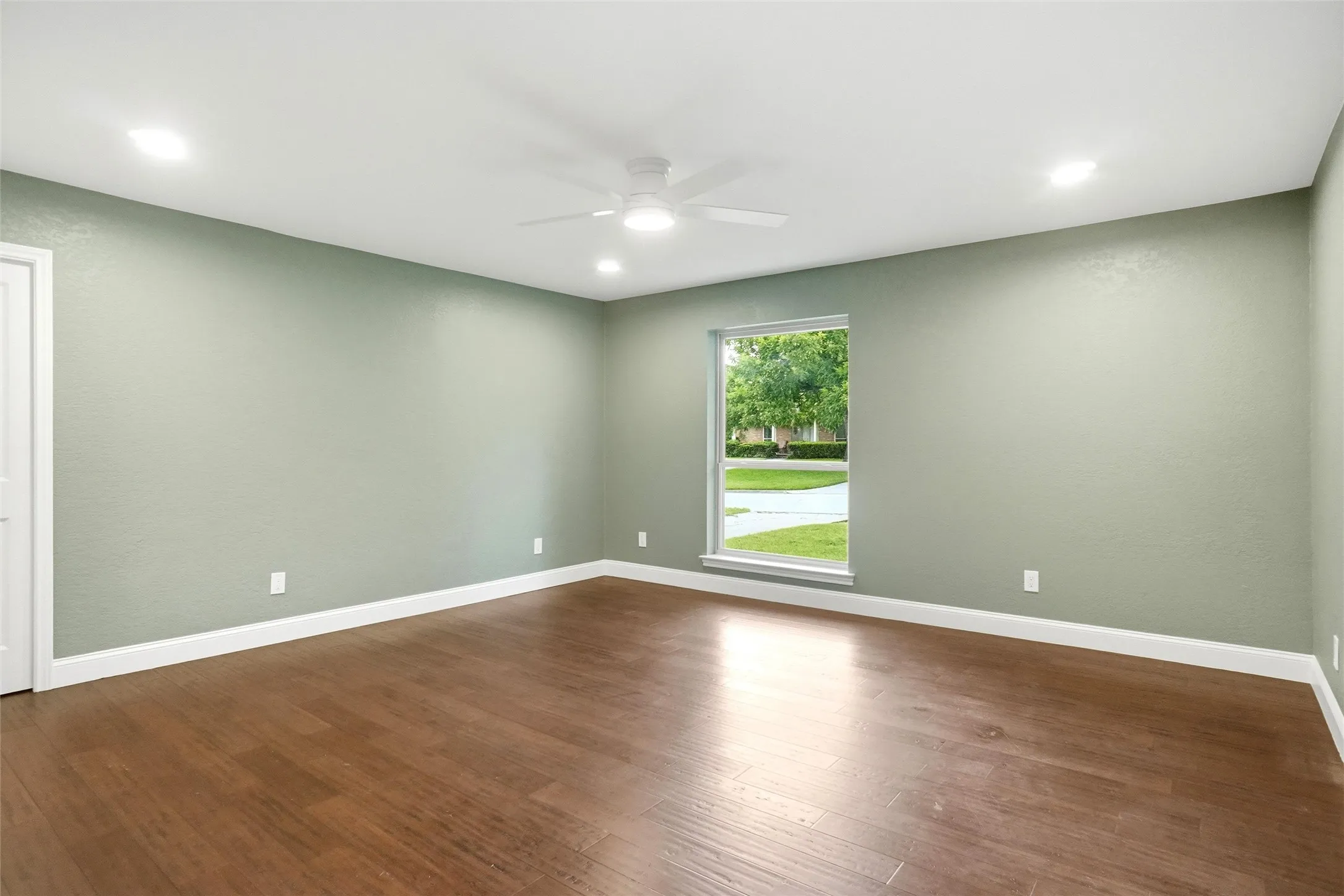 Primary bedroom; the pocket door on the left opens to a GINORMOUS walk in closet that is the length of this room! You might have to buy some new stuff!