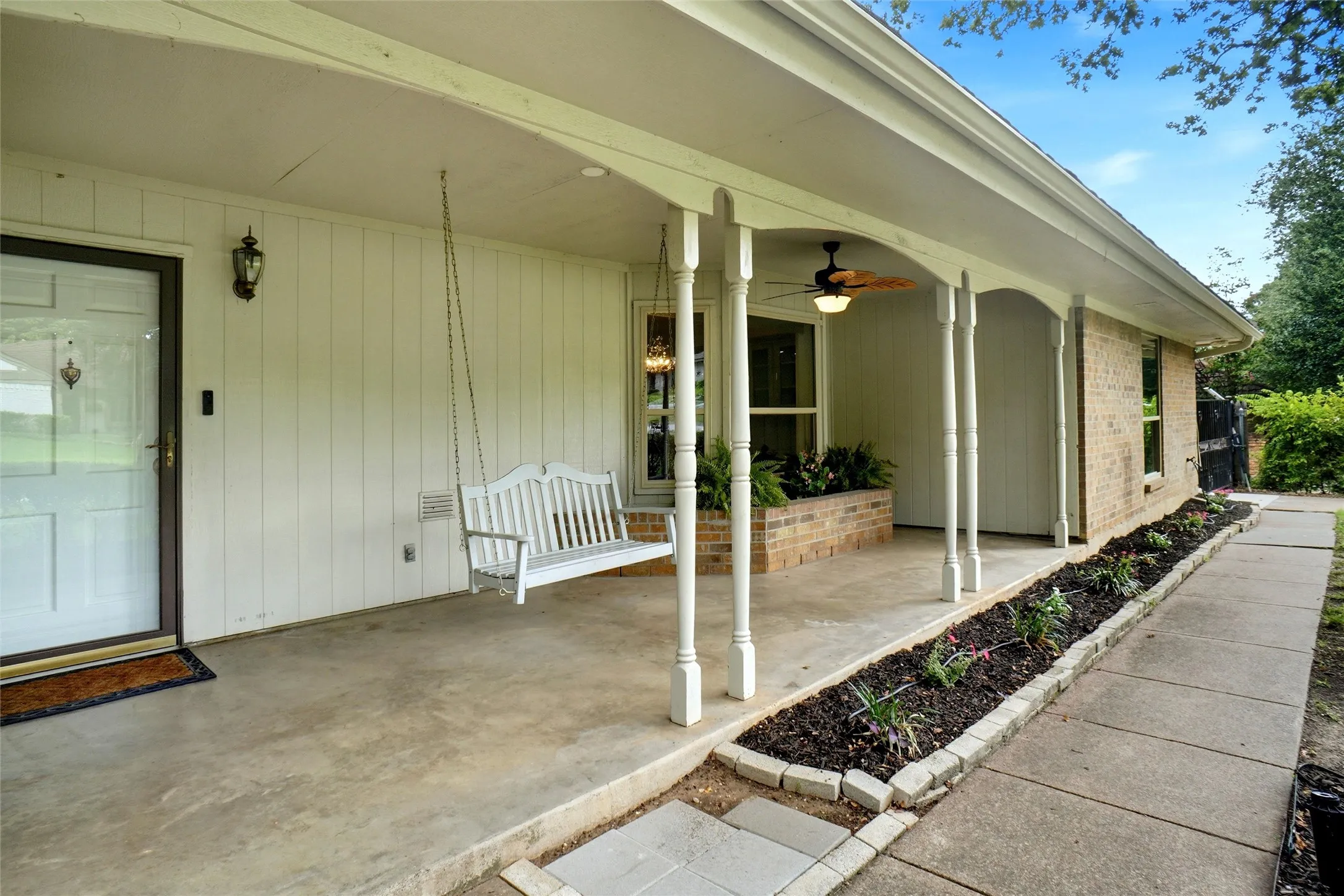 Front porch, for watching the world go by. Faces southeast, for shade in the evenings!