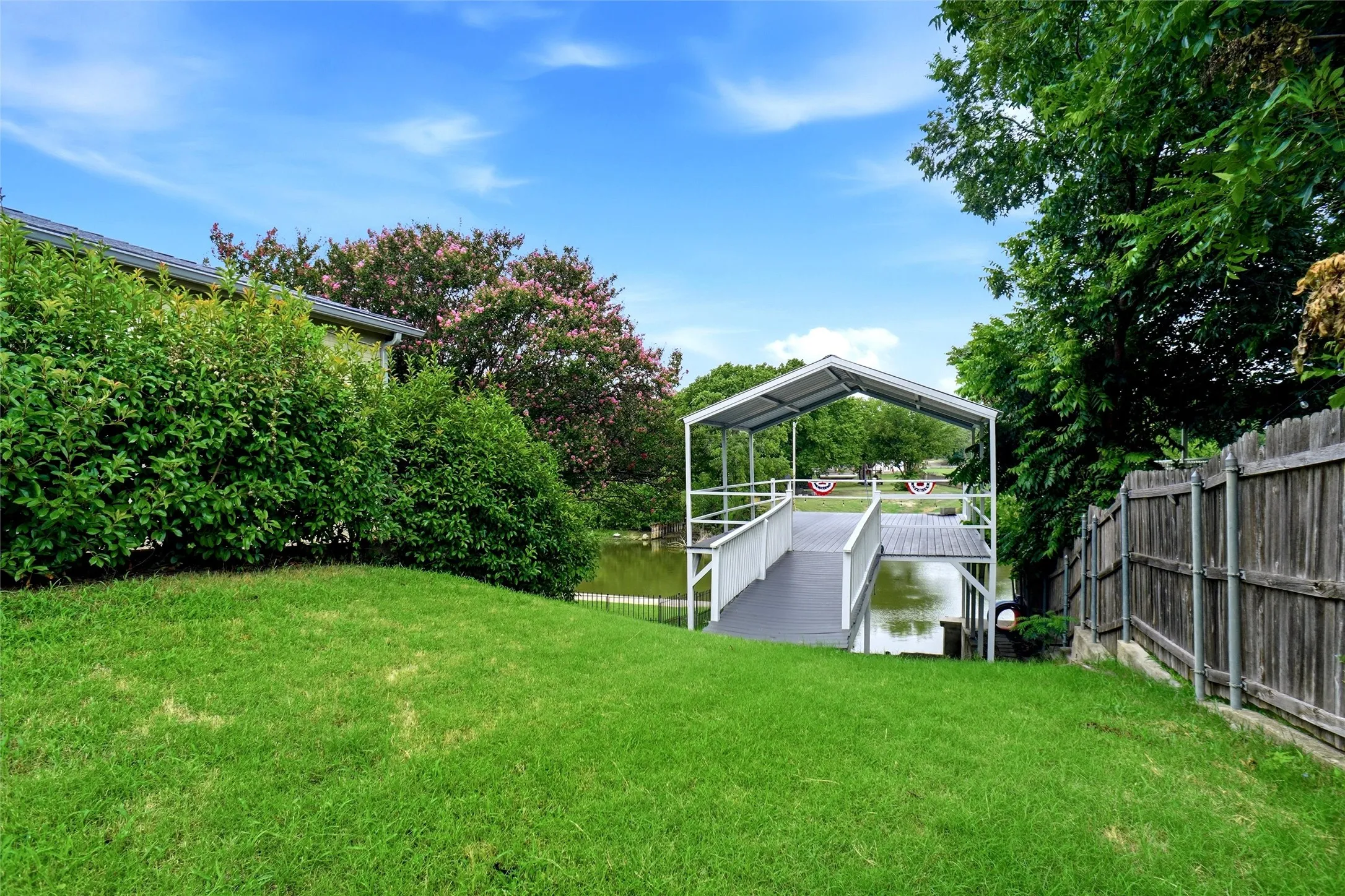 Boat slip below shaded deck area! Only yards to main body water!