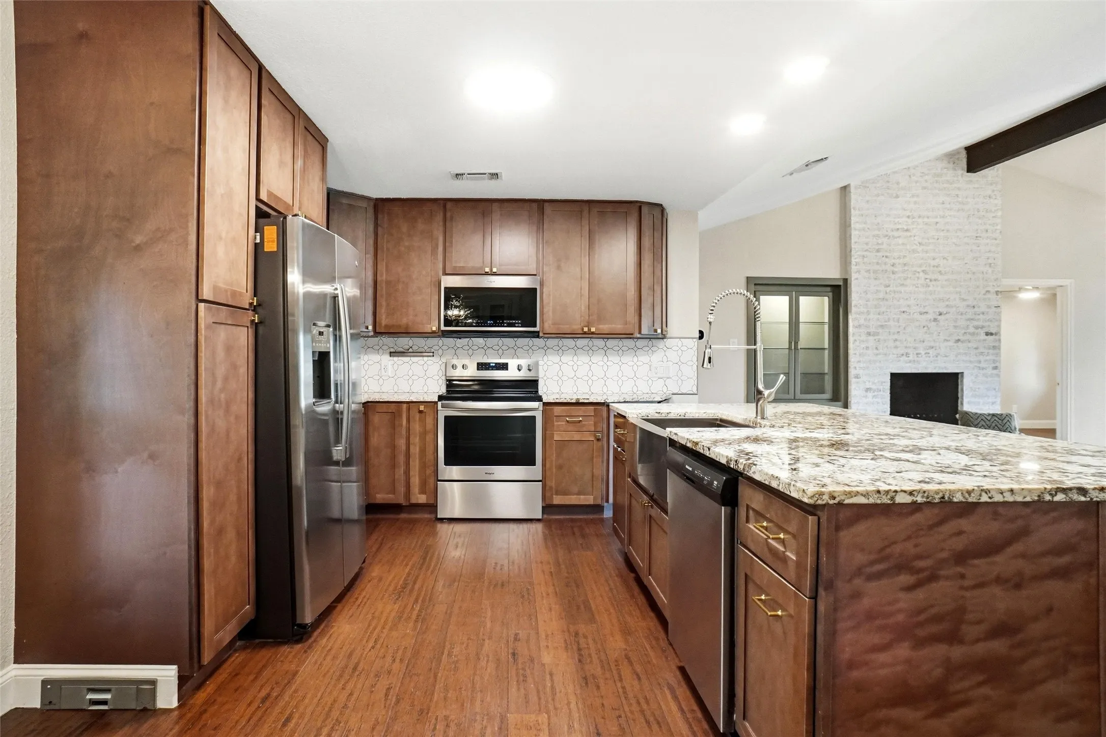 View of kitchen from the breakfast area. Living area is to the right of this photo.