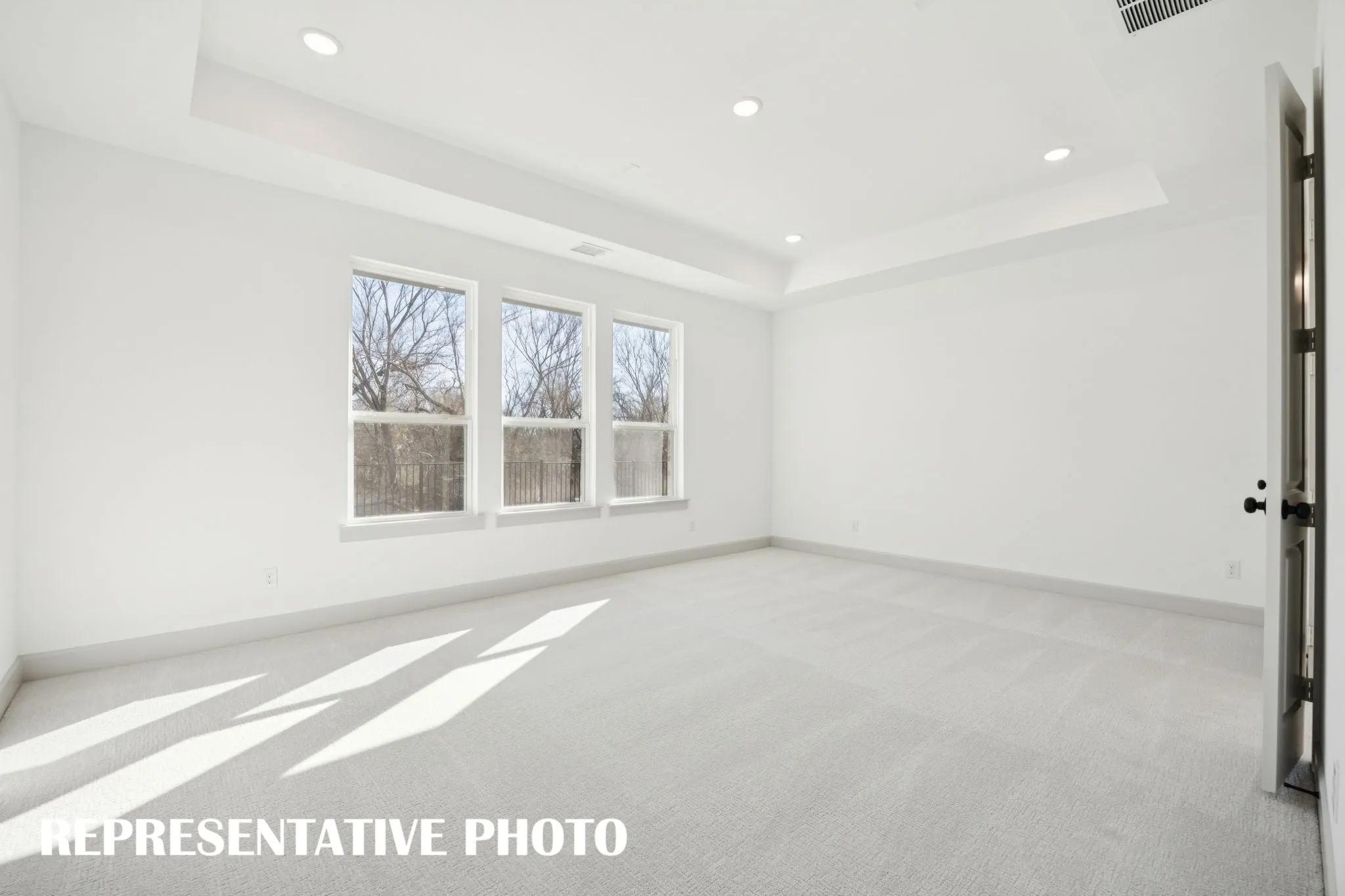 Located at the rear of the home for additional privacy, this dreamy owner's suite was designed for rest and relaxation!  REPRESENTATIVE PHOTO