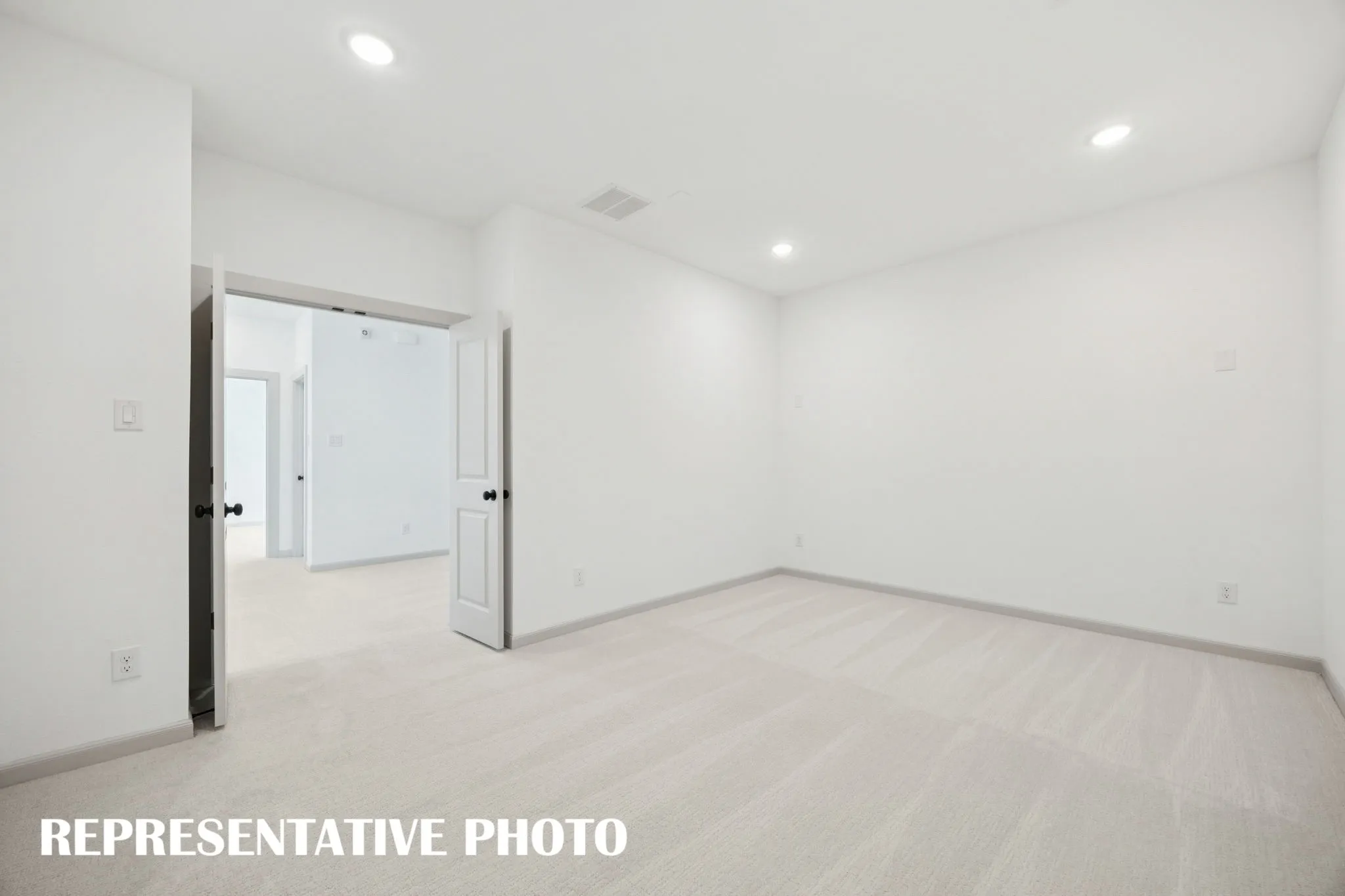 This spacious media room with adjacent game room creates the ultimate family entertainment zone!  REPRESENTATIVE PHOTO