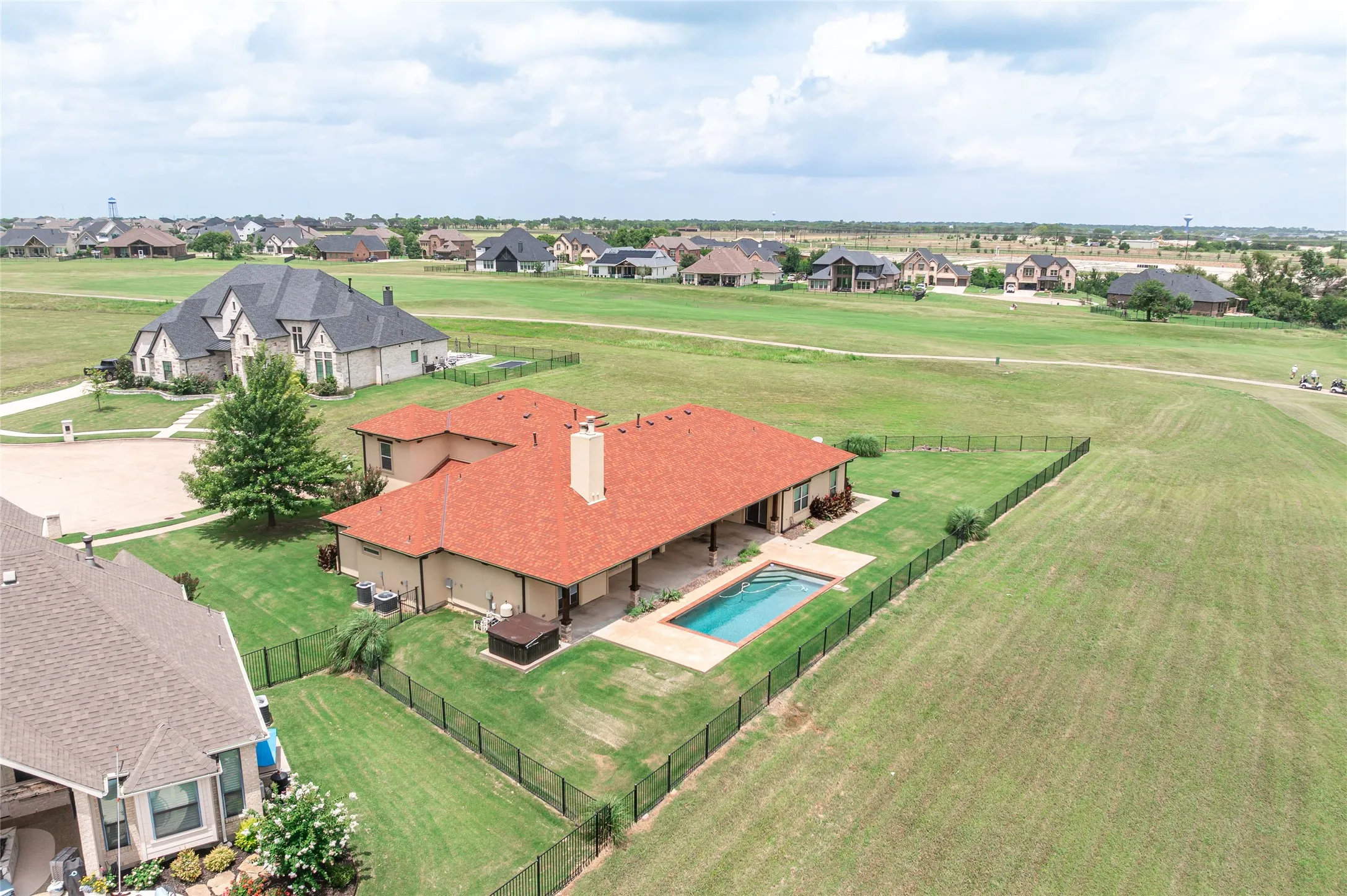 The best lot in the Bridges!  You can see two golf course holes from this home.