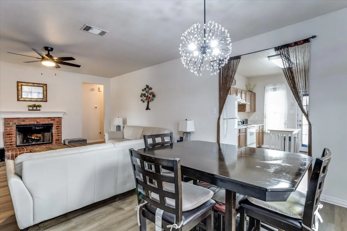 Open-concept dining space with modern sputnik chandelier