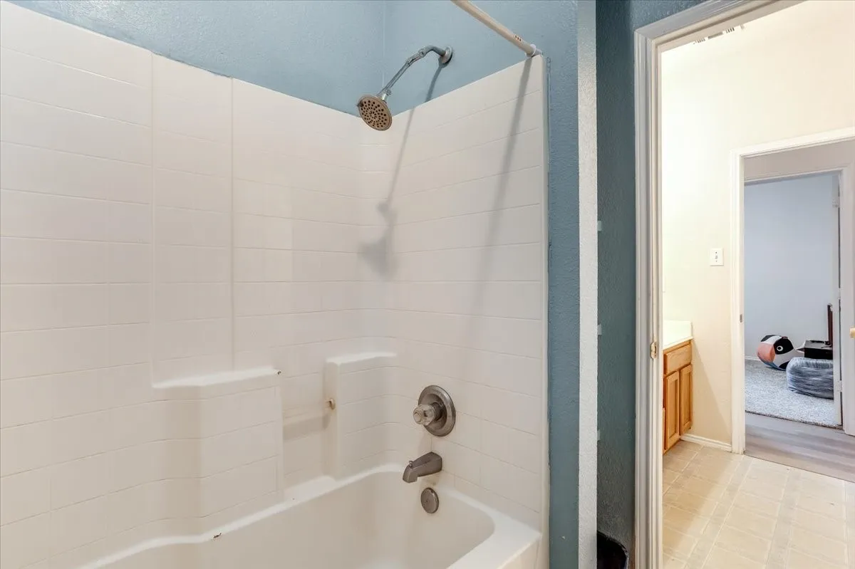 Bathtub and shower combination, and dual sinks in hallway