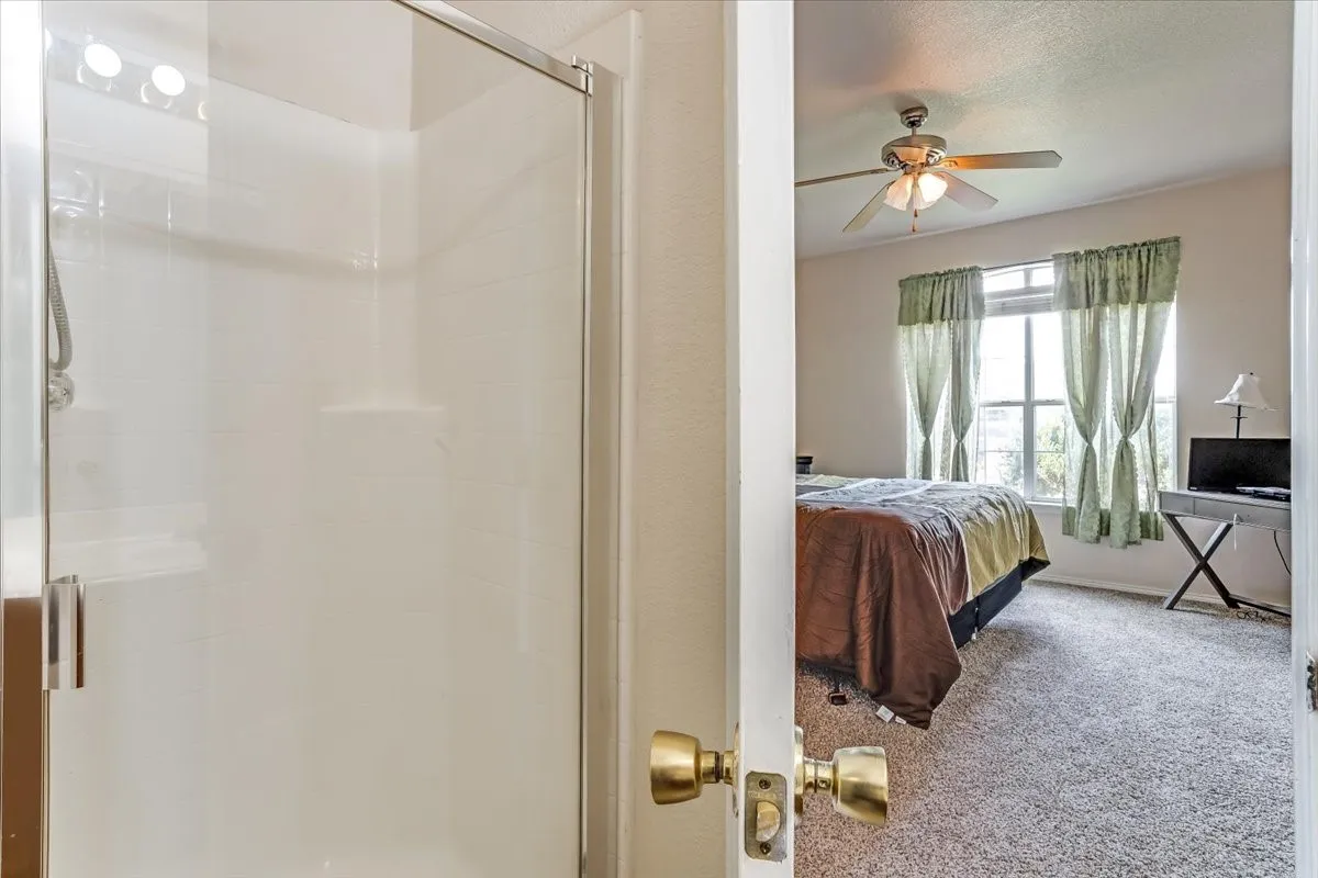Primary bedroom and ensuite with separate shower and jetted garden tub