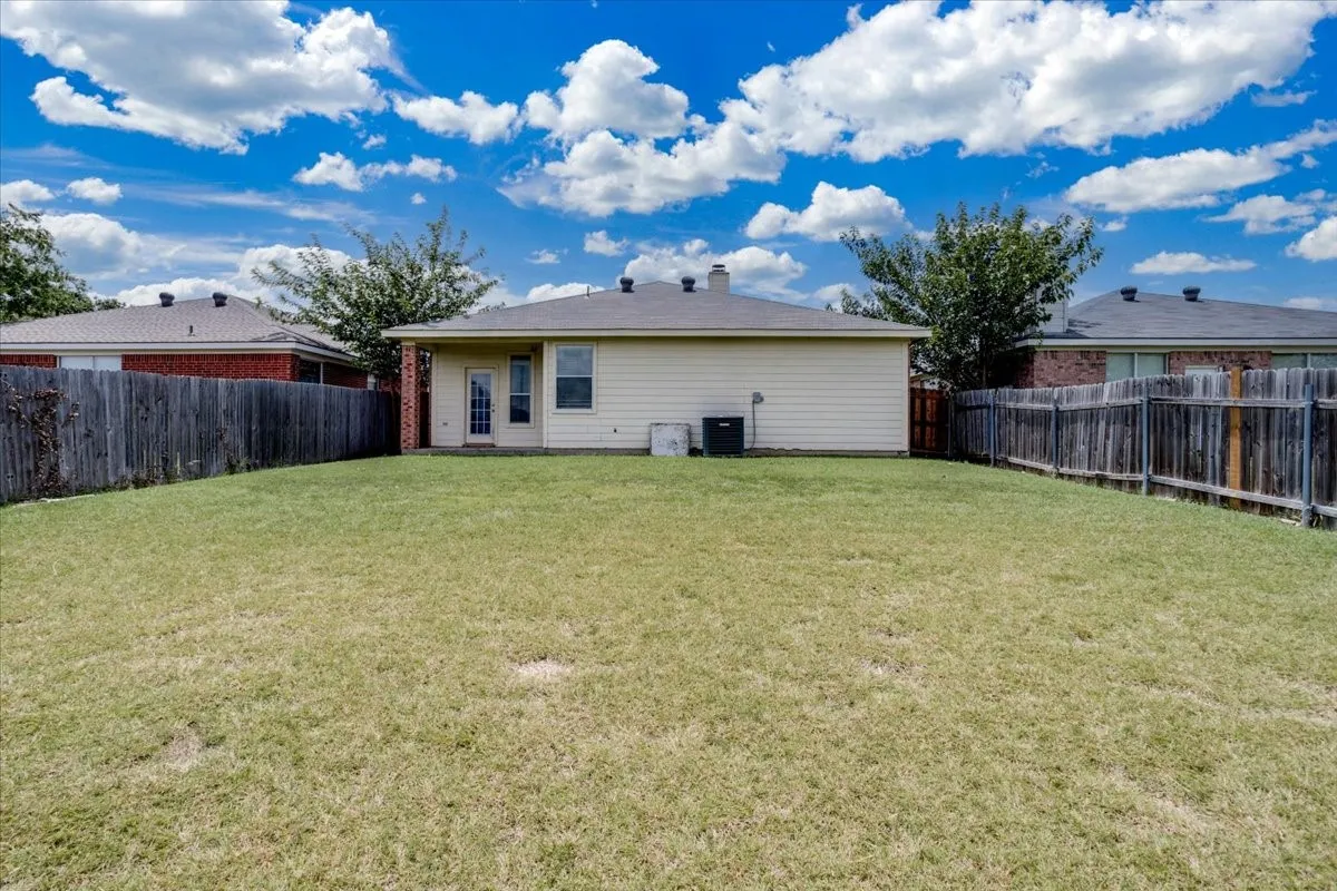 Expansive backyard featuring a full fencing, and covered porch