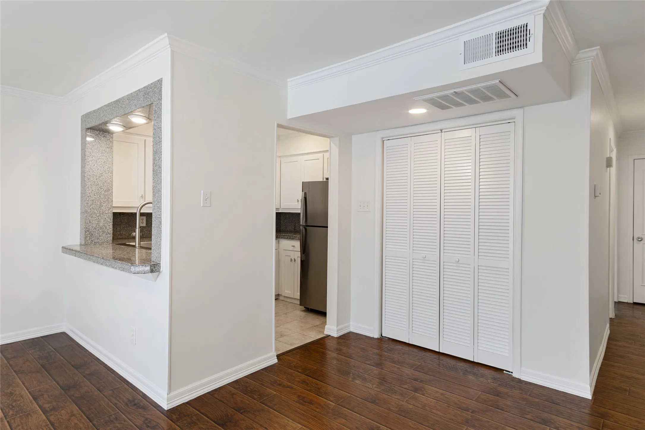 Laundry closet adjacent to the kitchen