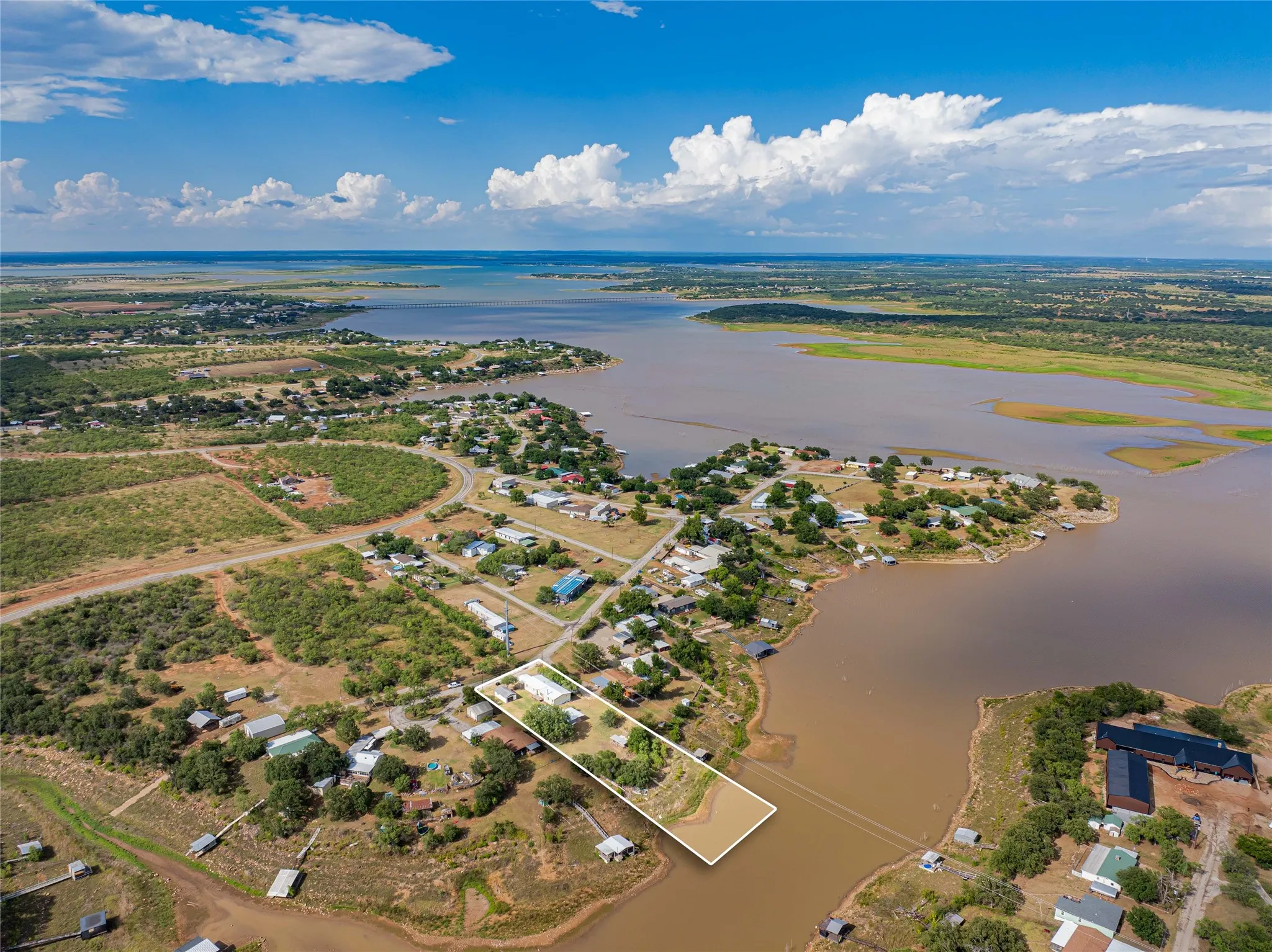 Aerial perspective showcasing a waterfront property with direct water access