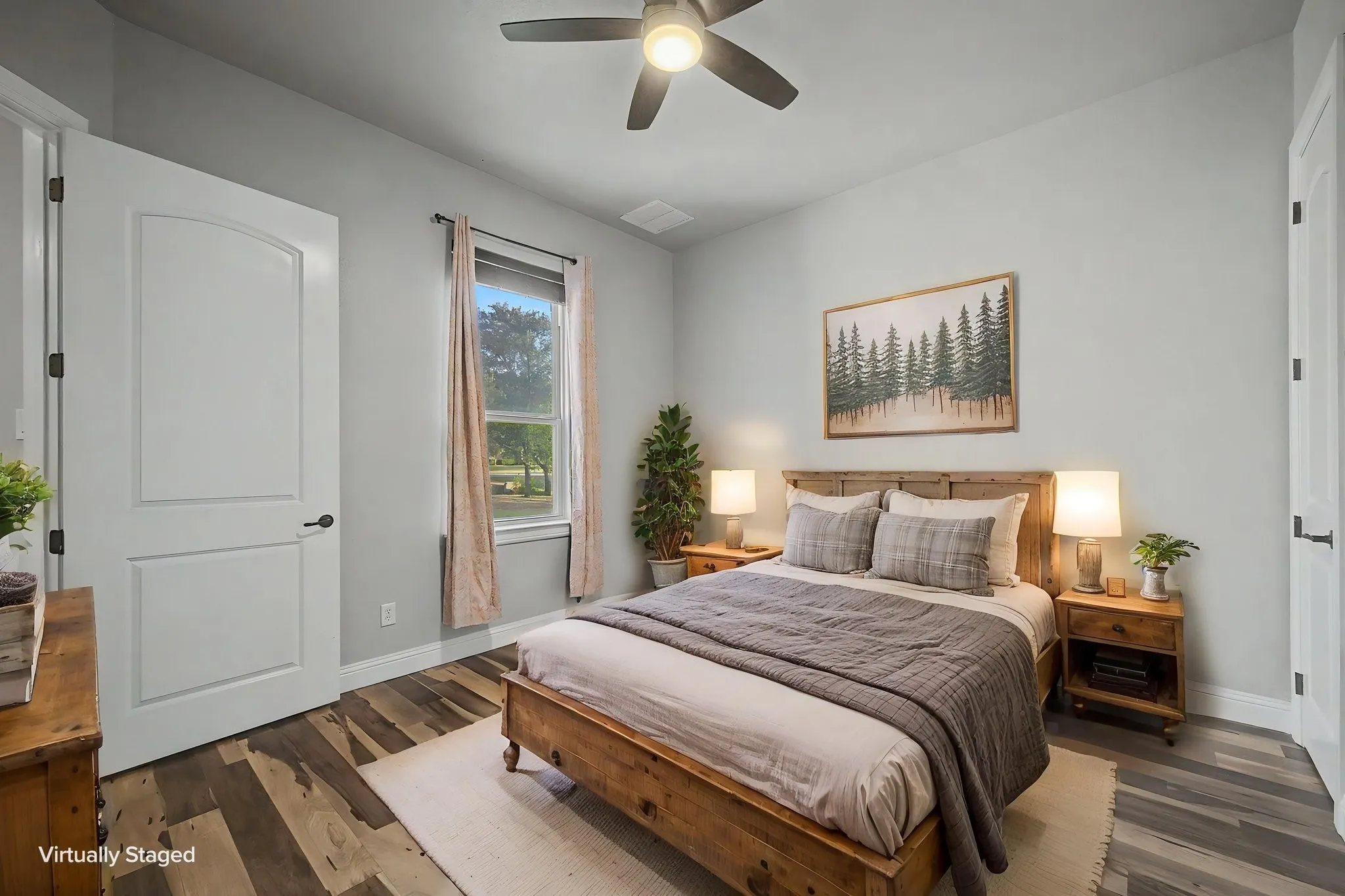 Main-level bedroom offering flexible space for a bedroom, guest room, or home office.