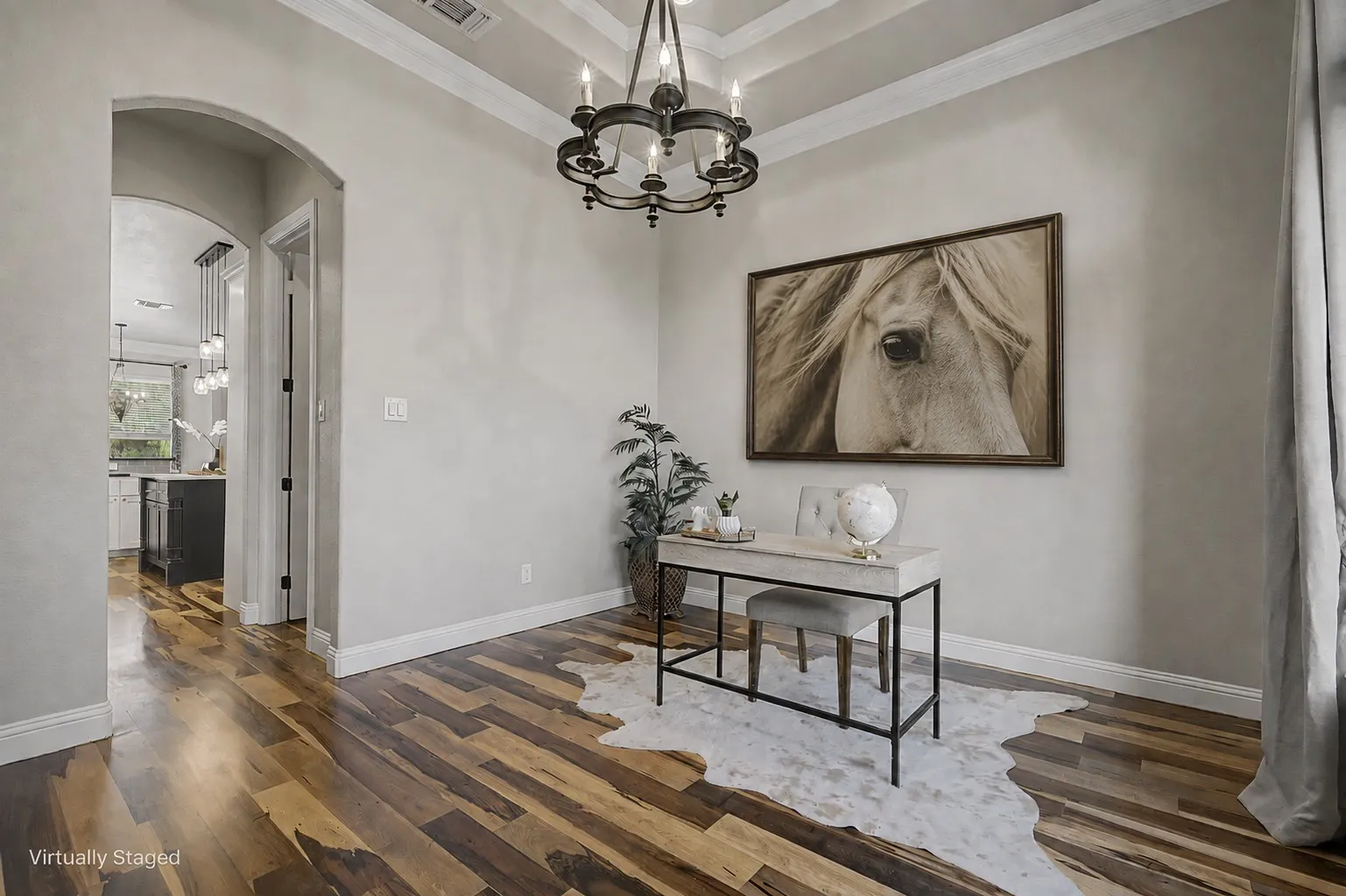 Situated off the foyer, ideal for an office or spacious dining area with updated finishes and convenient access to the kitchen and main living spaces.
