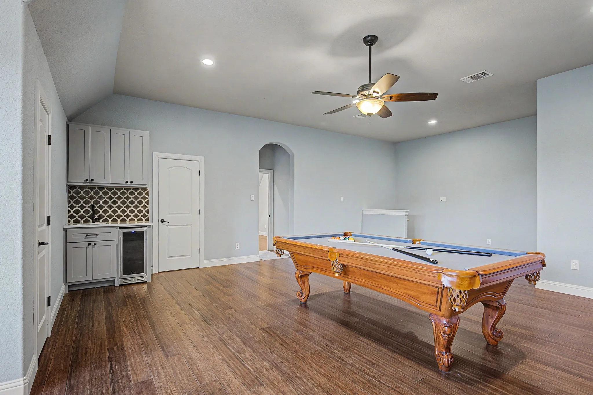 Private upstairs guest bedroom suite features an ensuite full bath and separation from the main-level bedrooms.