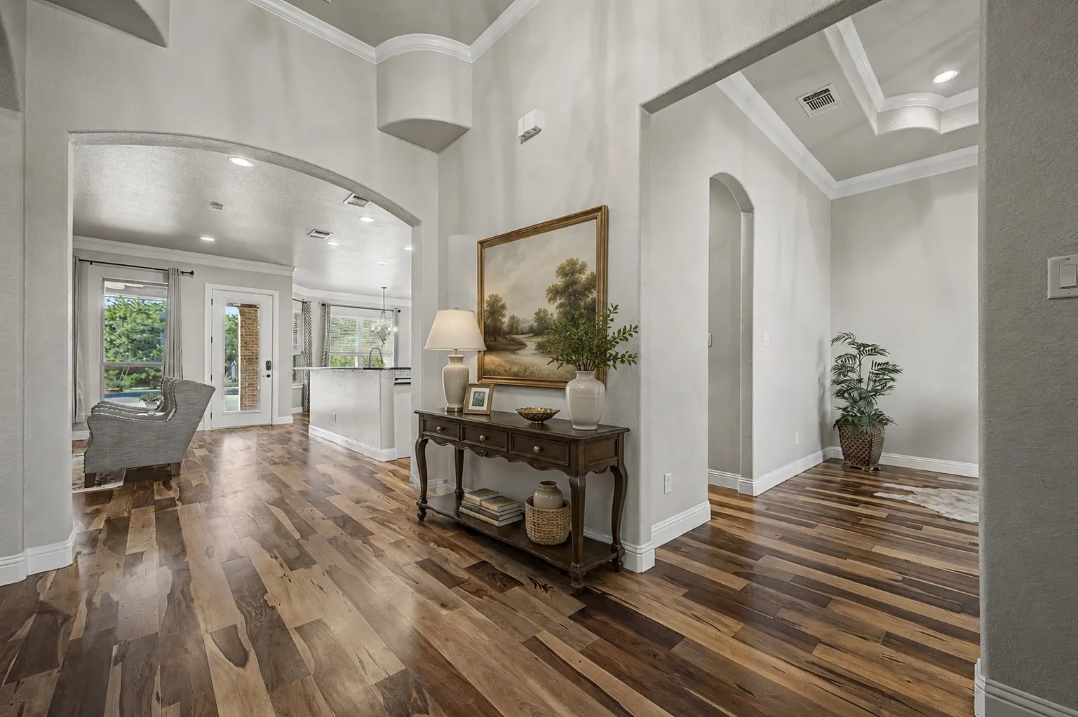 Virtually staged foyer. Welcoming entry with updated flooring, neutral finishes, and natural light
