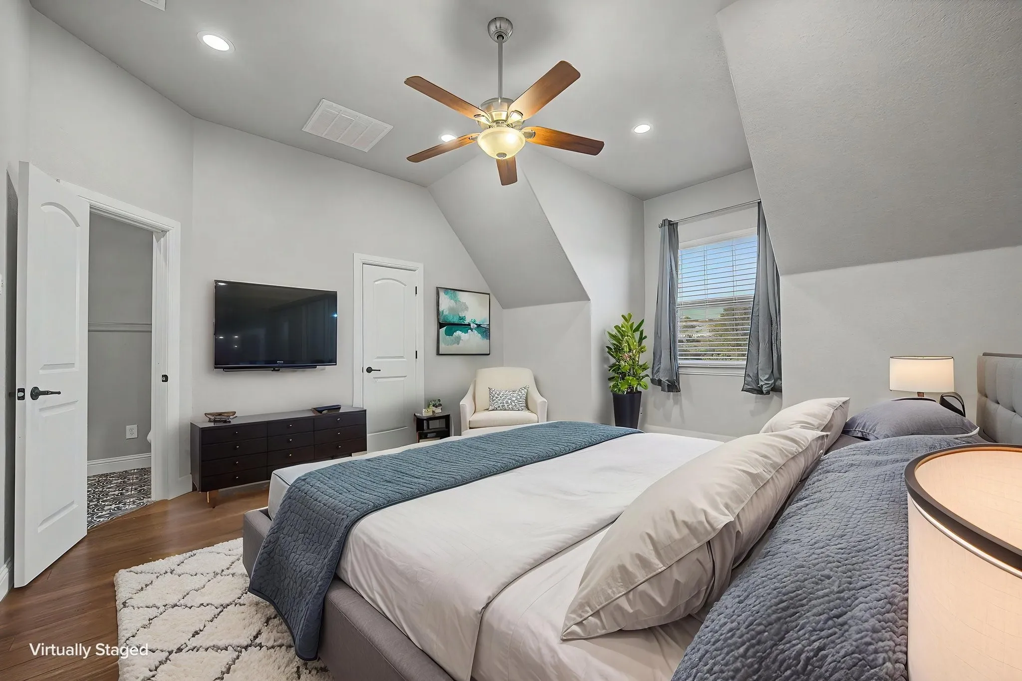 Fifth bedroom located upstairs provides additional separation from the main-level bedrooms and flexible living options.