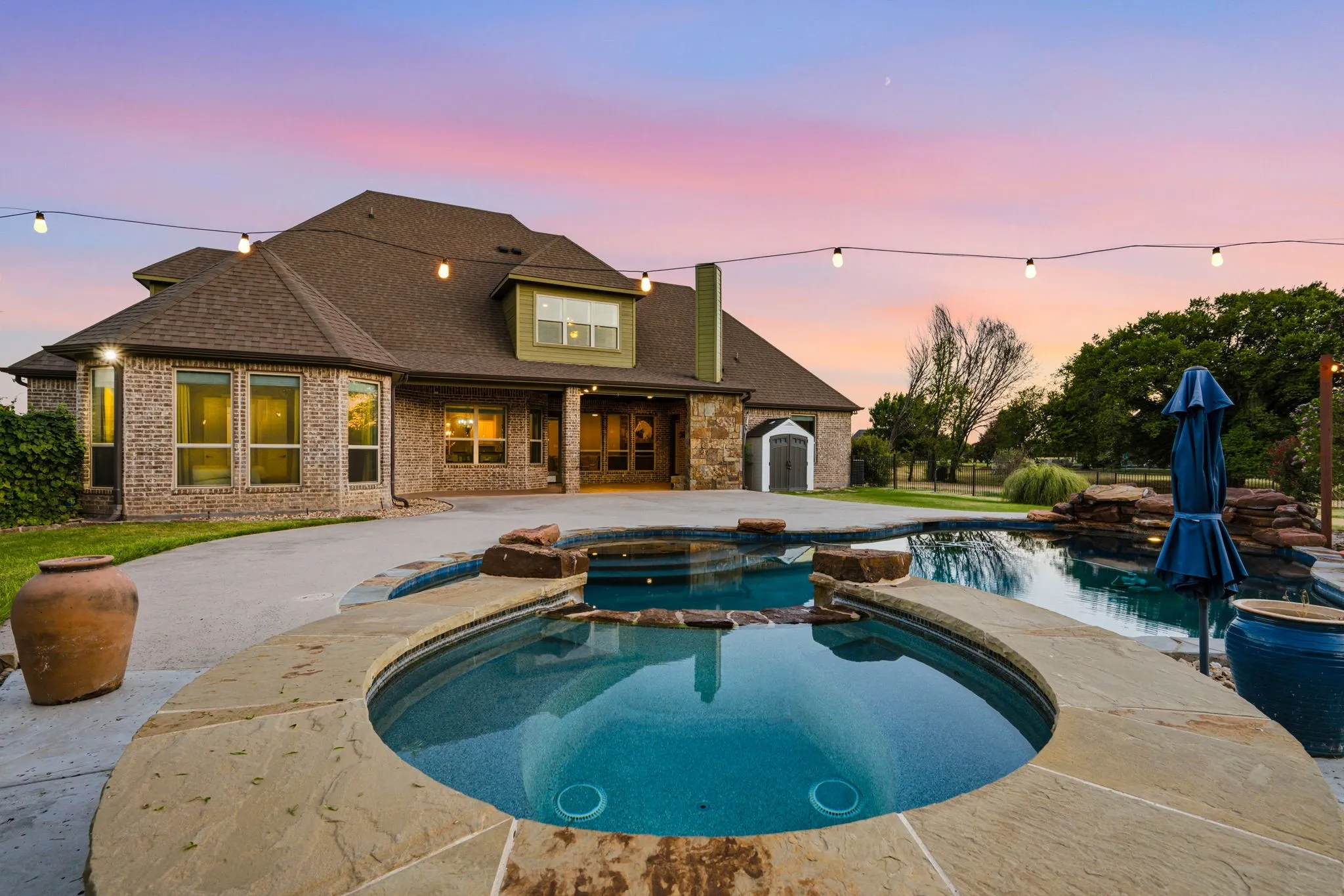 Backyard features a sparkling pool and newer spa for year-round outdoor enjoyment.