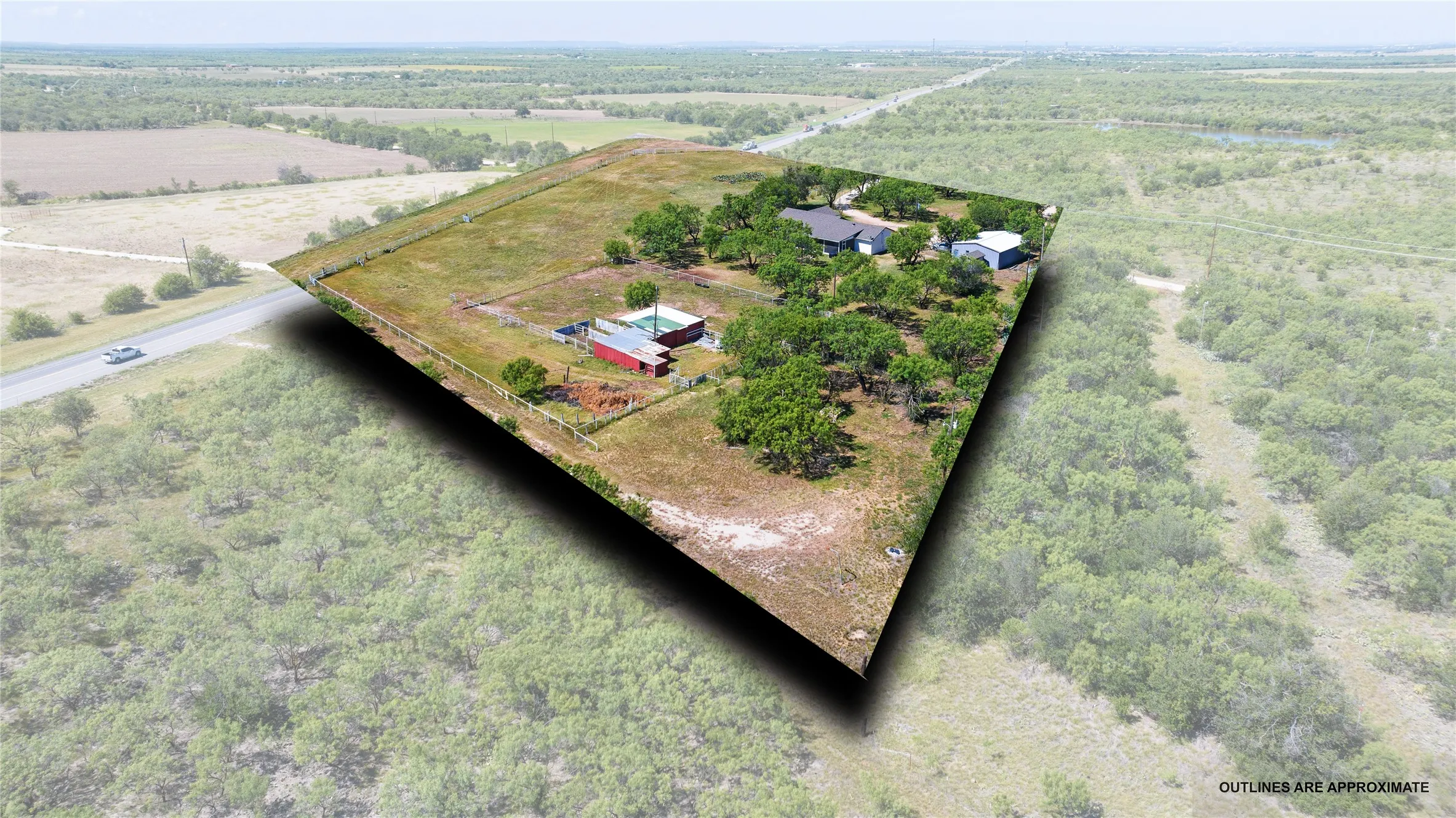 Expansive rural property featuring a main residence, multiple outbuildings, mature trees, and open land