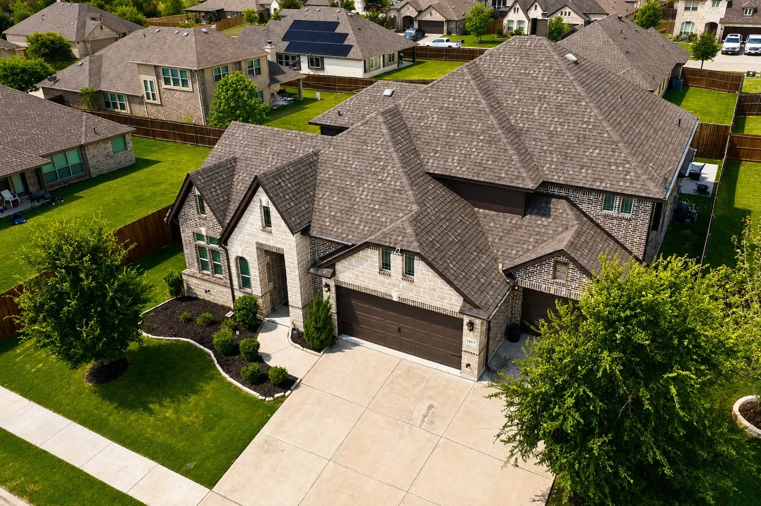 Stone and brick exterior with a multi-gabled roofline
