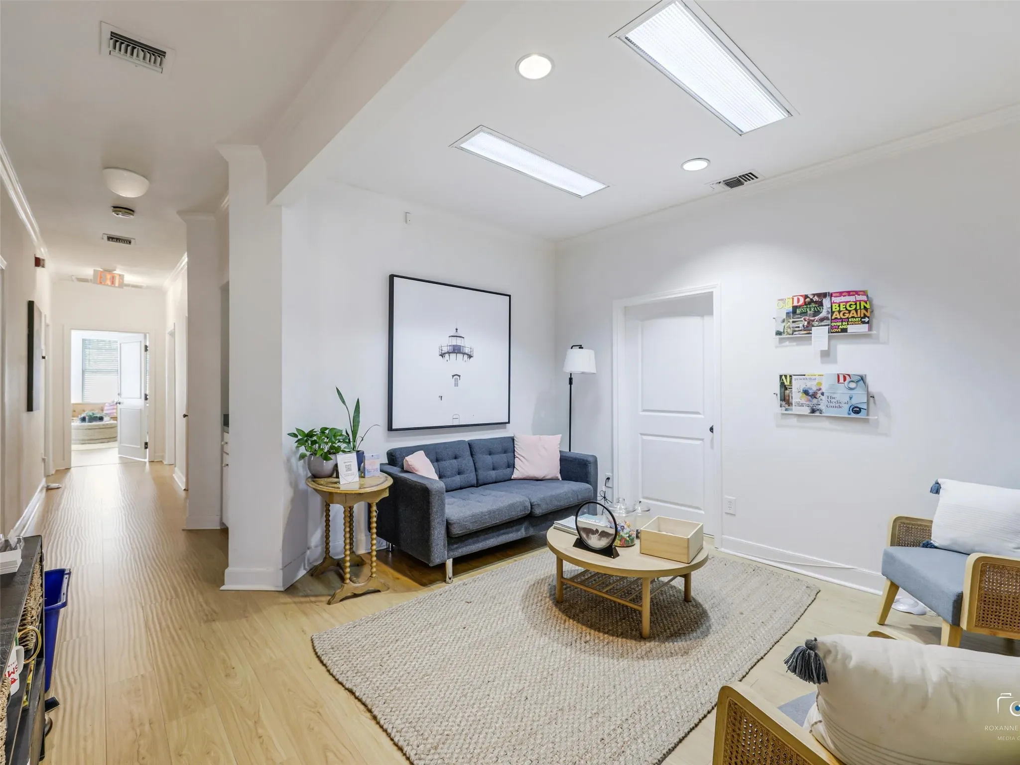 Second floor reception area with wood-finish flooring