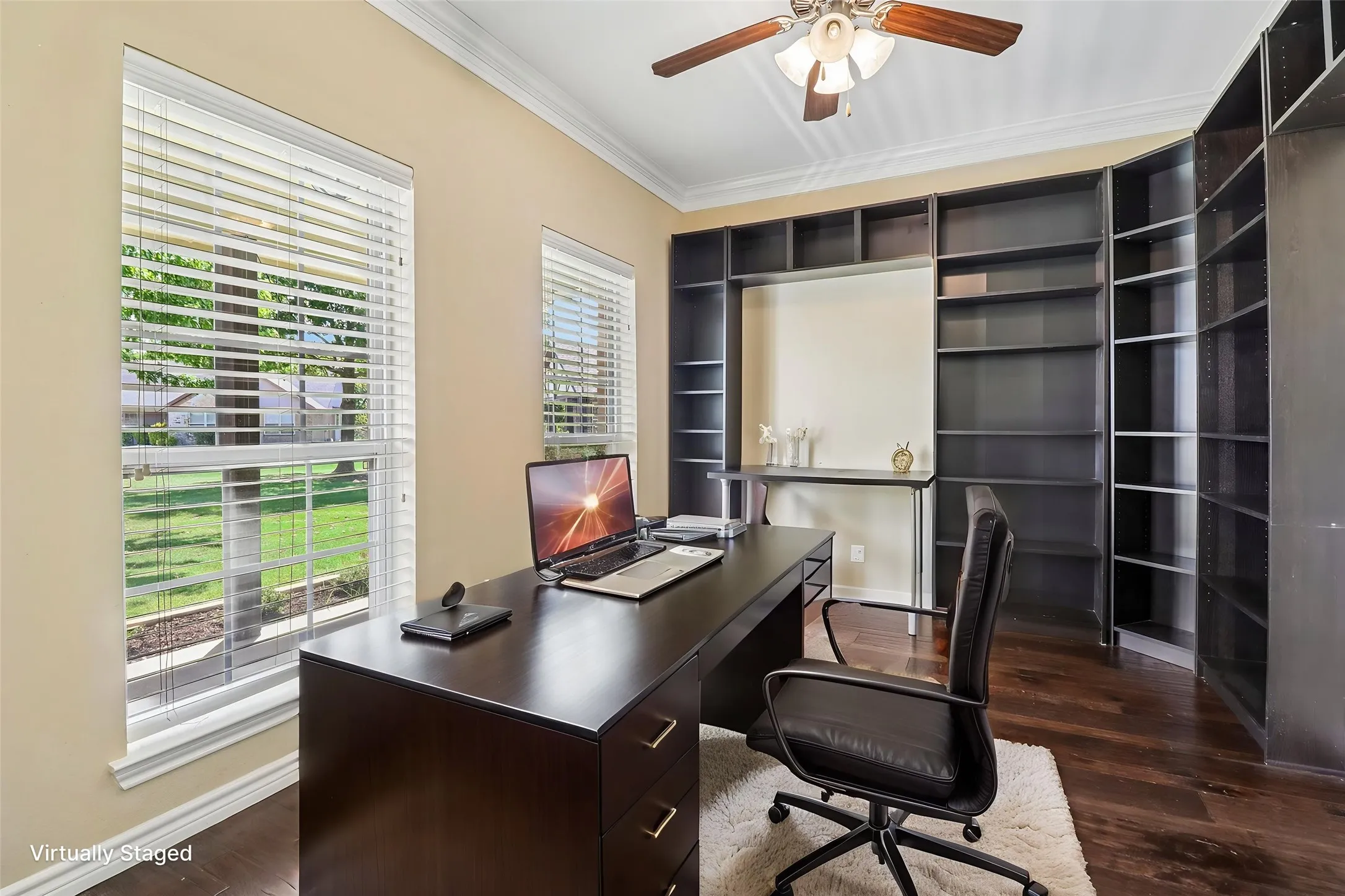 Large front office with built in bookshelves. Great space for meeting with clients or working from home office.