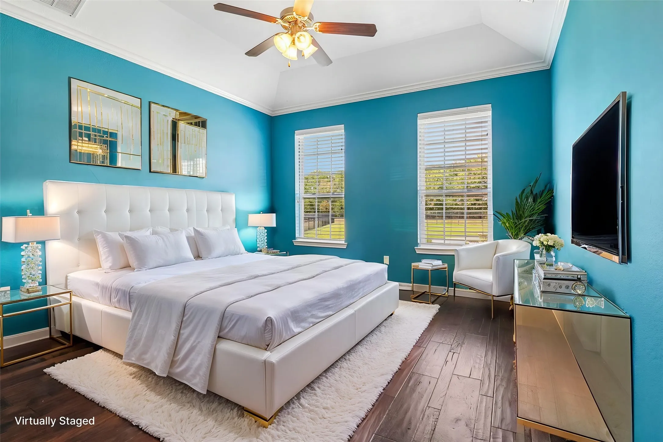 Private primary bedroom with space for a sitting area.