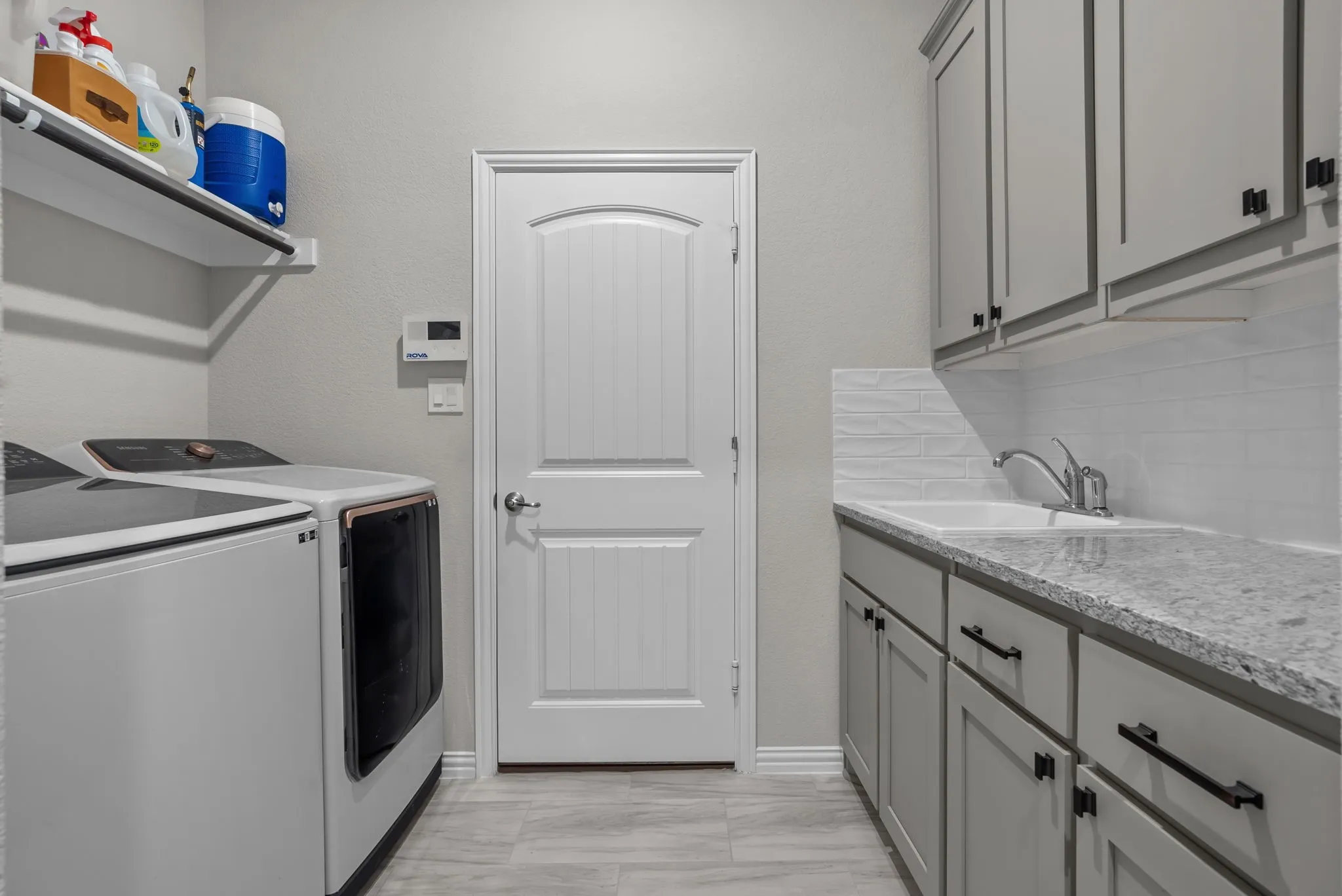 Laundry/mud room with entry to garage