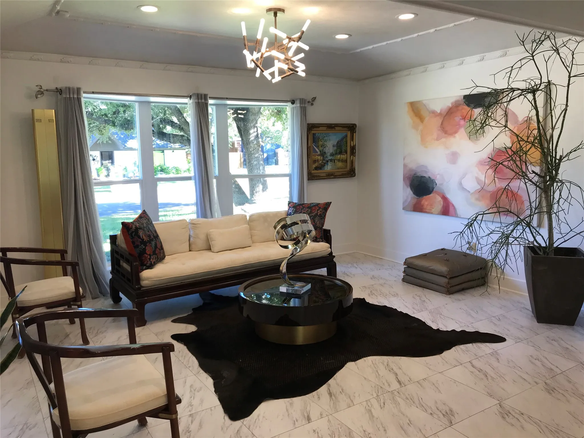 Recessed lighting, ornamental ceiling trim, large windows, and tile flooring