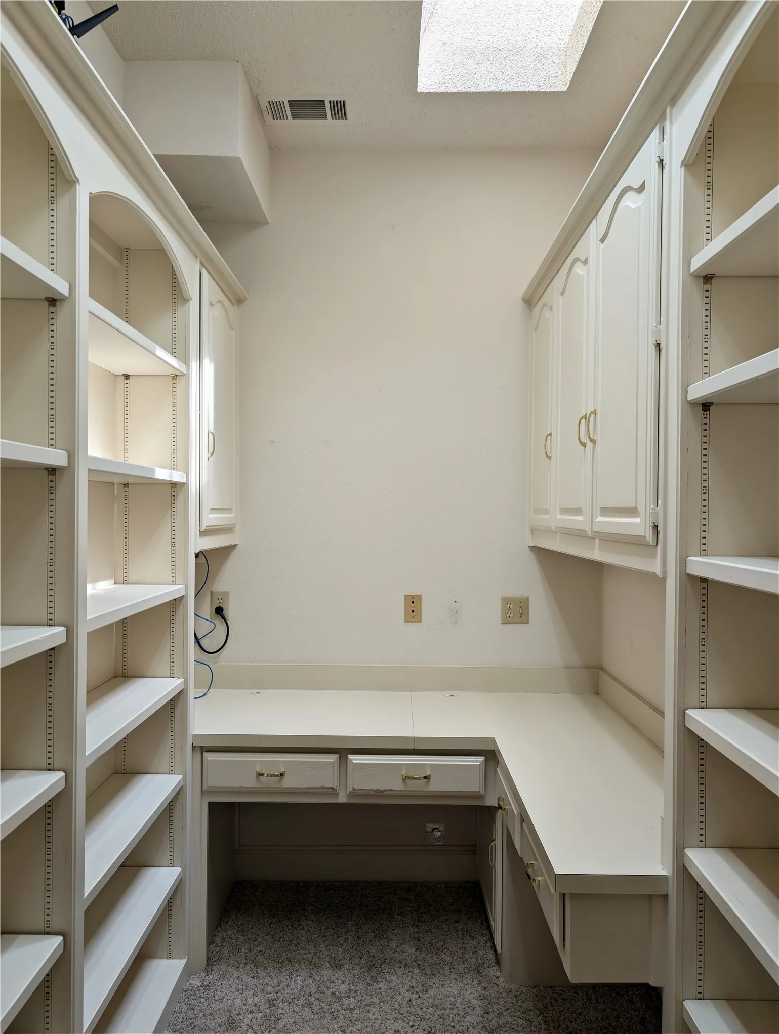 Study/office with built-in shelves and cabinetry