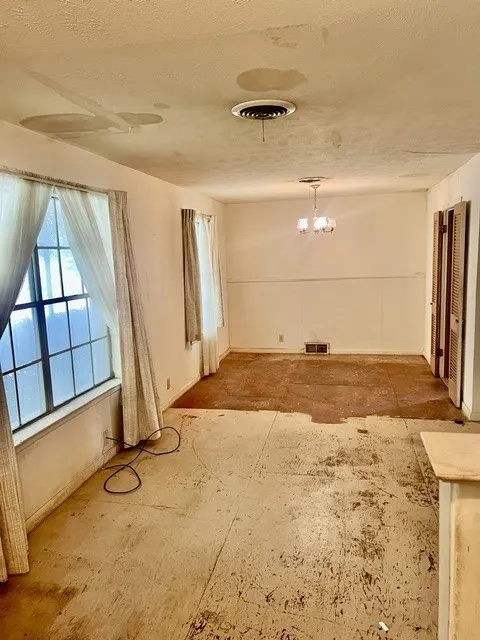 living room looking into dining room that passes through kitchen