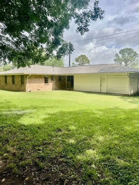 Expansive green lawn providing ample outdoor space