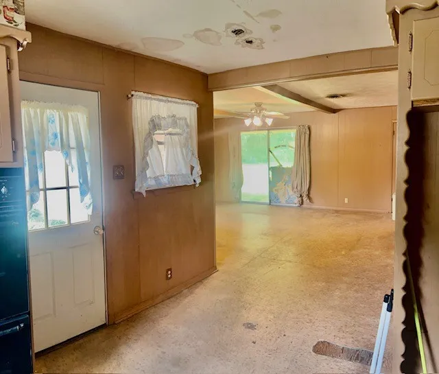 from Kitchen looking at the back door and sliding glass door to back covered patio