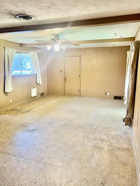 Add. Living room with interior door going into the garage