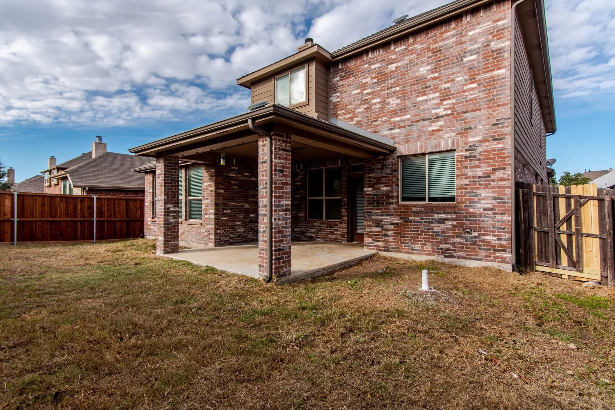 Brick exterior with an expansive covered patio