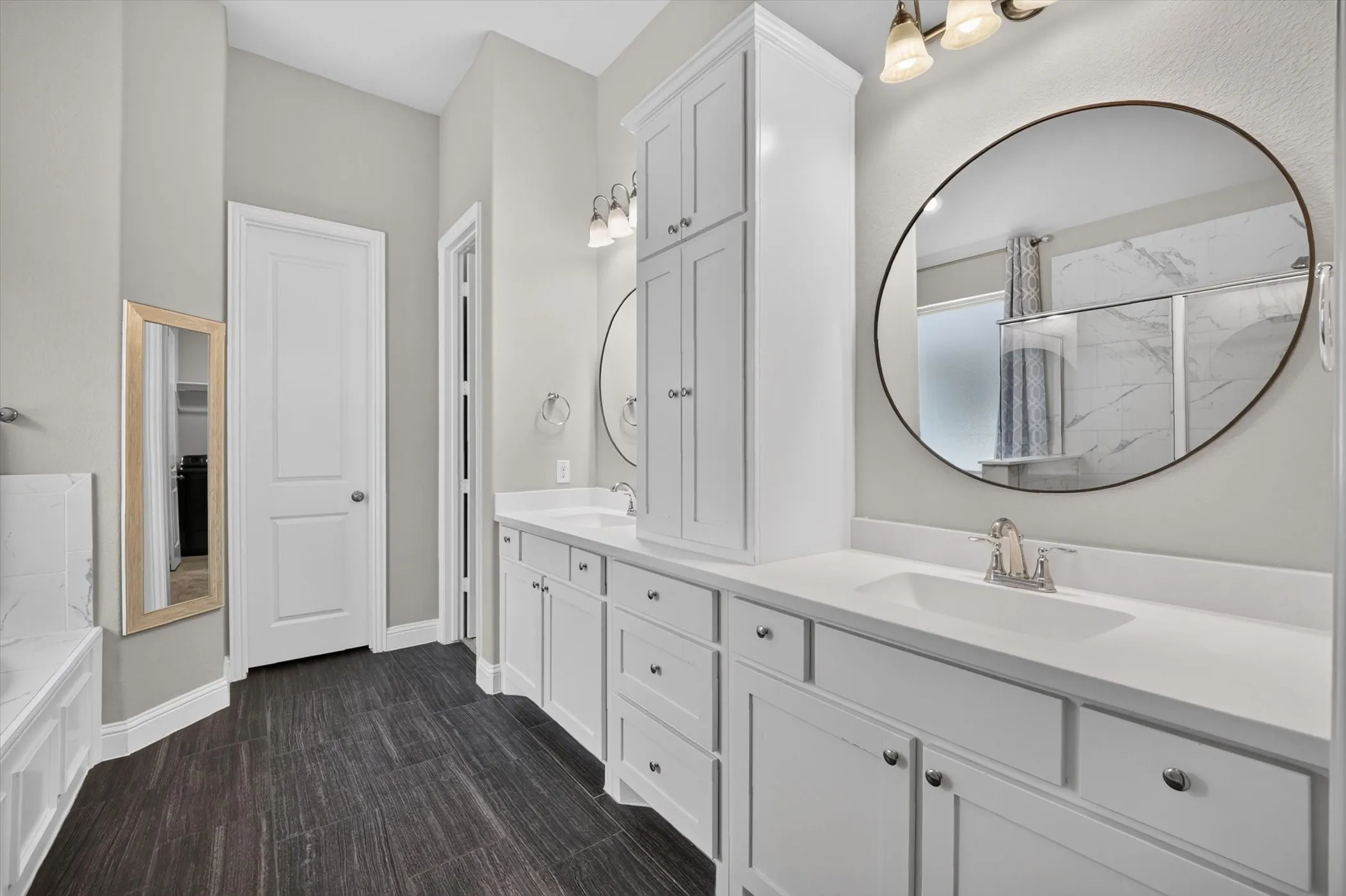 Double vanity with white cabinetry and integrated sinks