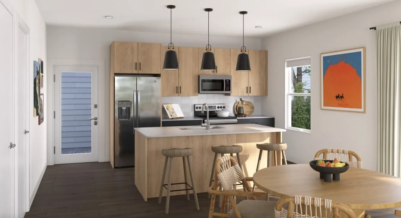 Kitchen featuring tasteful backsplash, stainless steel appliances, a kitchen island with sink, light brown cabinets, and decorative light fixtures