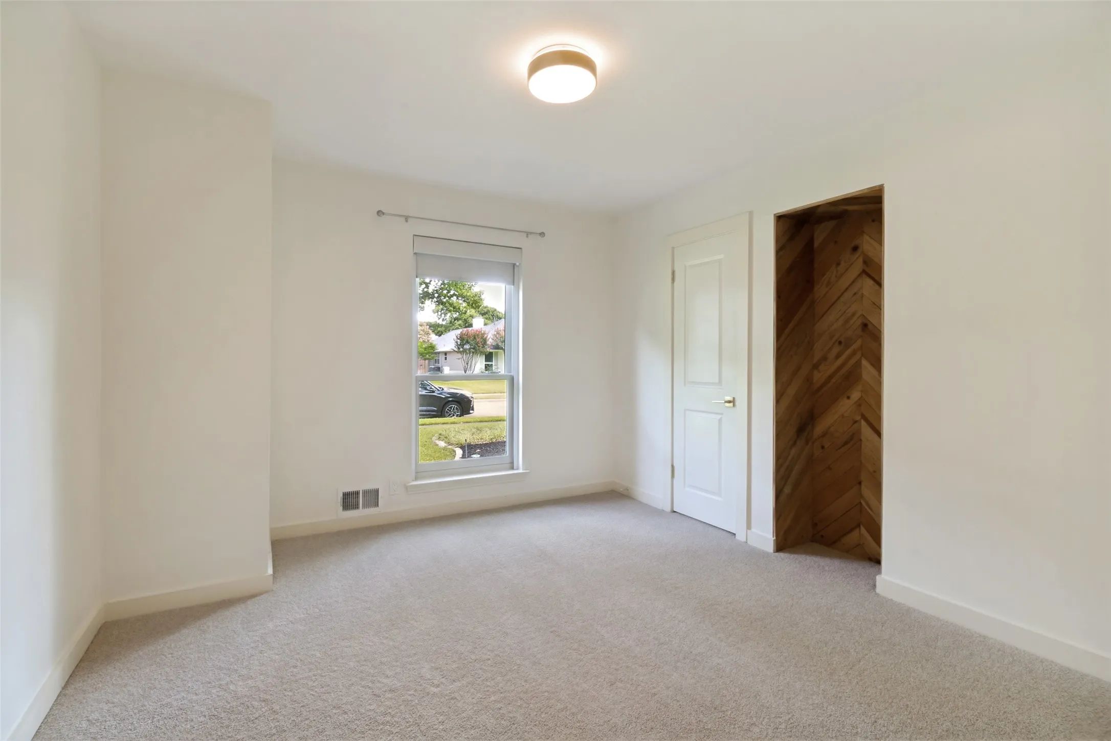Bedroom #2 with closet and electronic shades