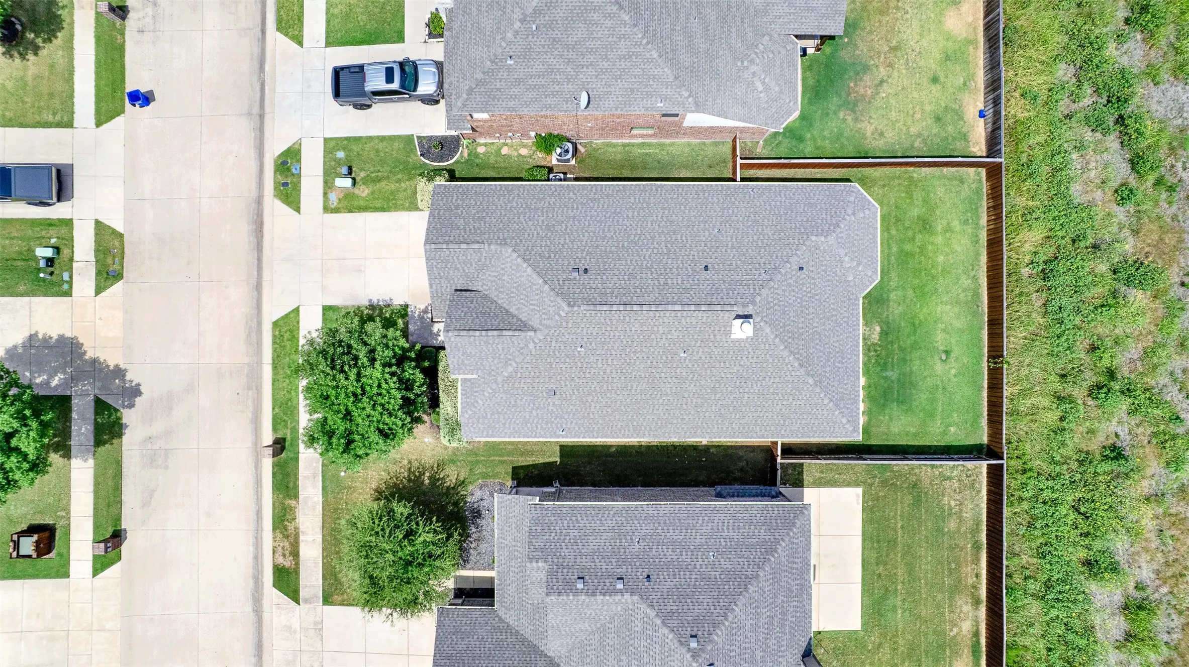 Aerial perspective showcasing a gabled roofline with asphalt shingles