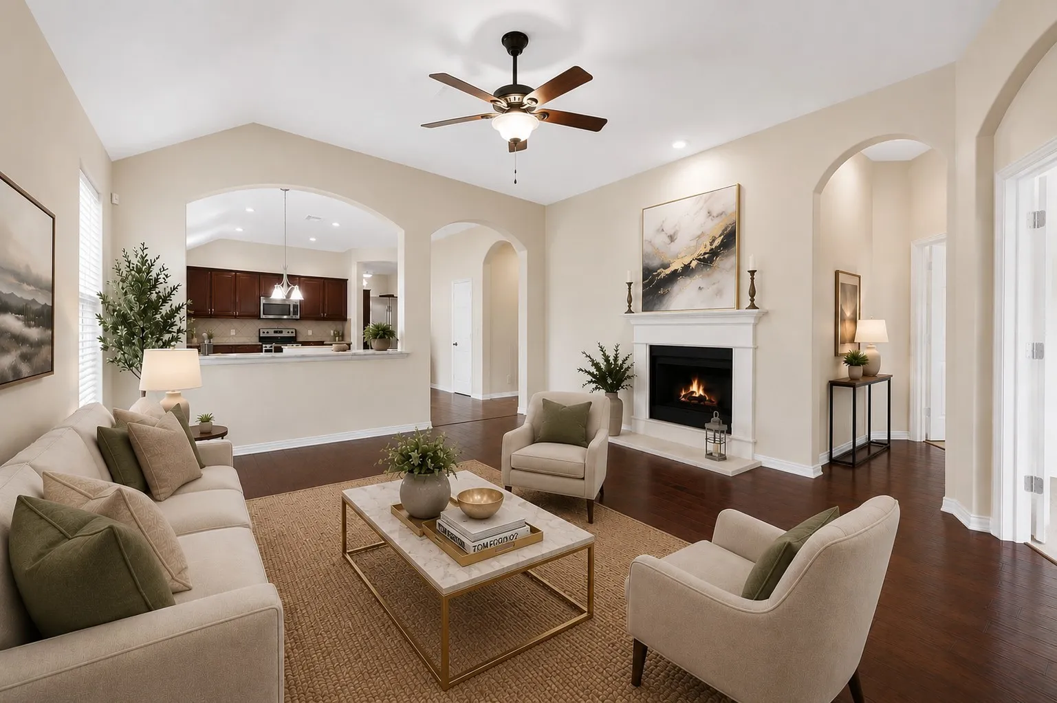 Spacious living area featuring vaulted ceilings, a built-in fireplace with a mantel, dark wood-finish flooring, recessed lighting, and arched doorways