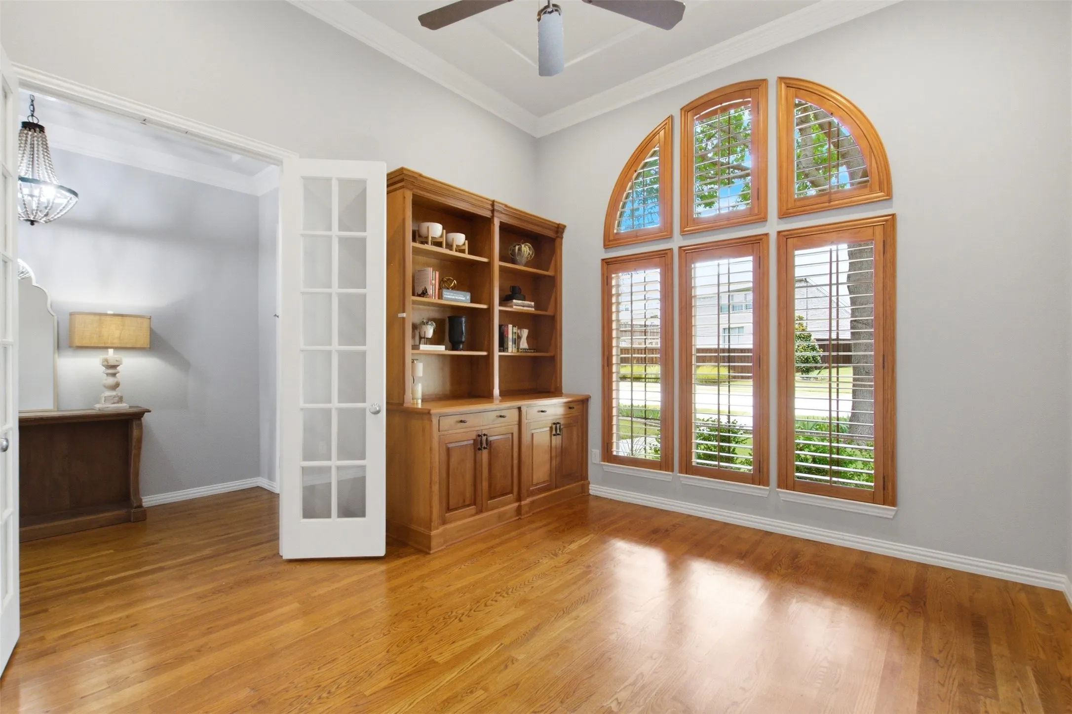 Study with 12 Ft Ceilings, Built-In Cabinet/Shelving & Plantation Shutters