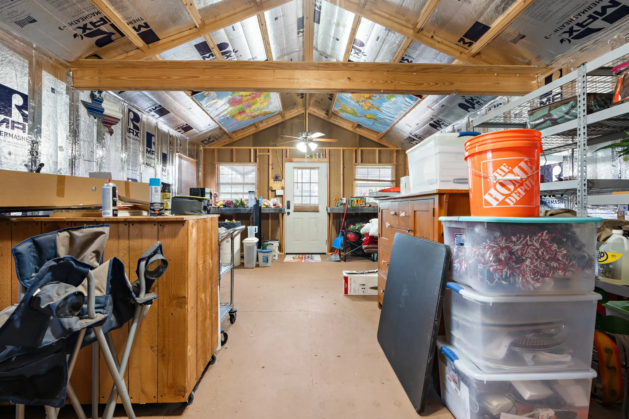 Spacious interior featuring exposed wooden rafters and a vaulted ceiling
