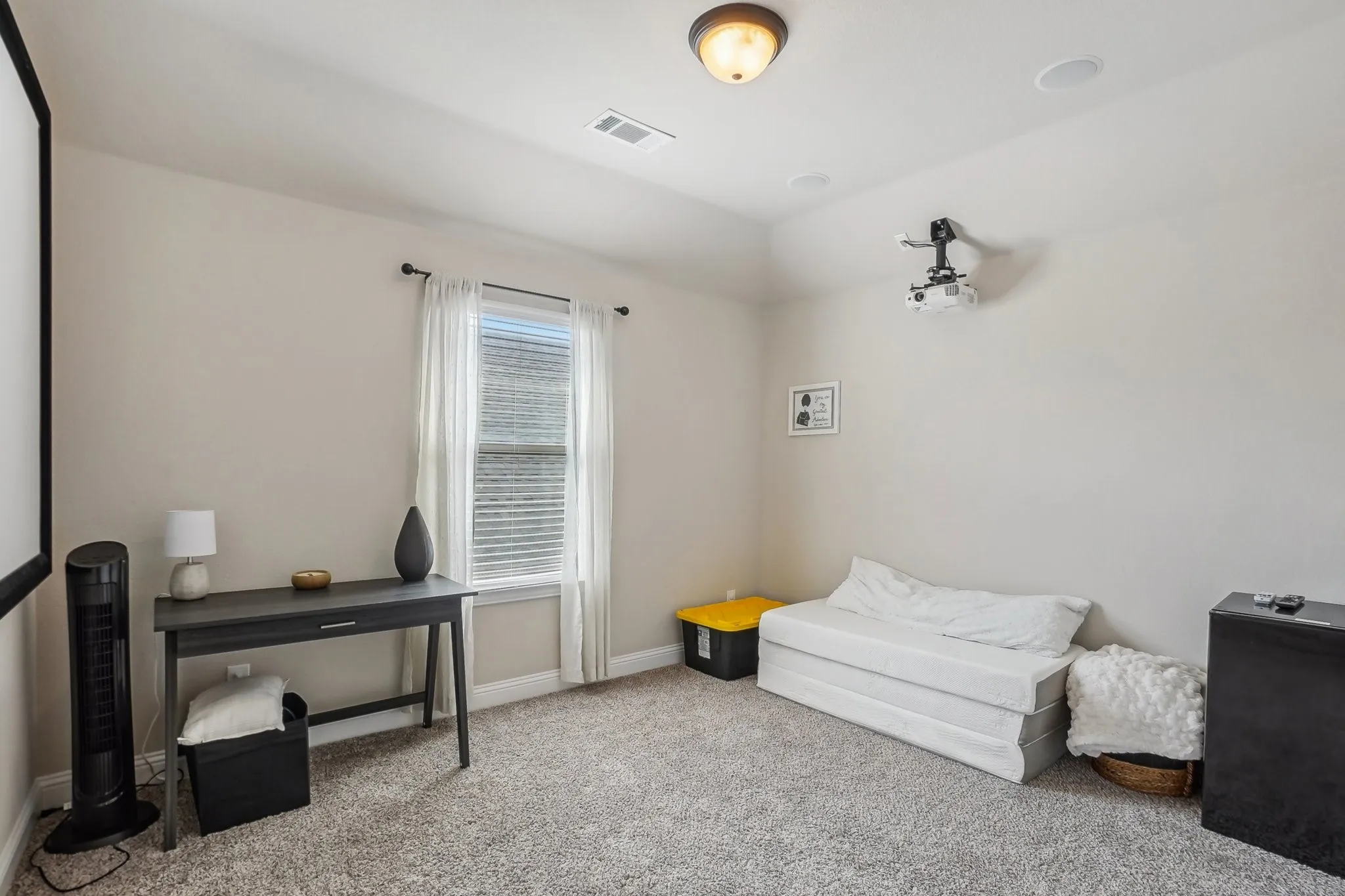 Bedroom/media with carpet flooring and baseboards